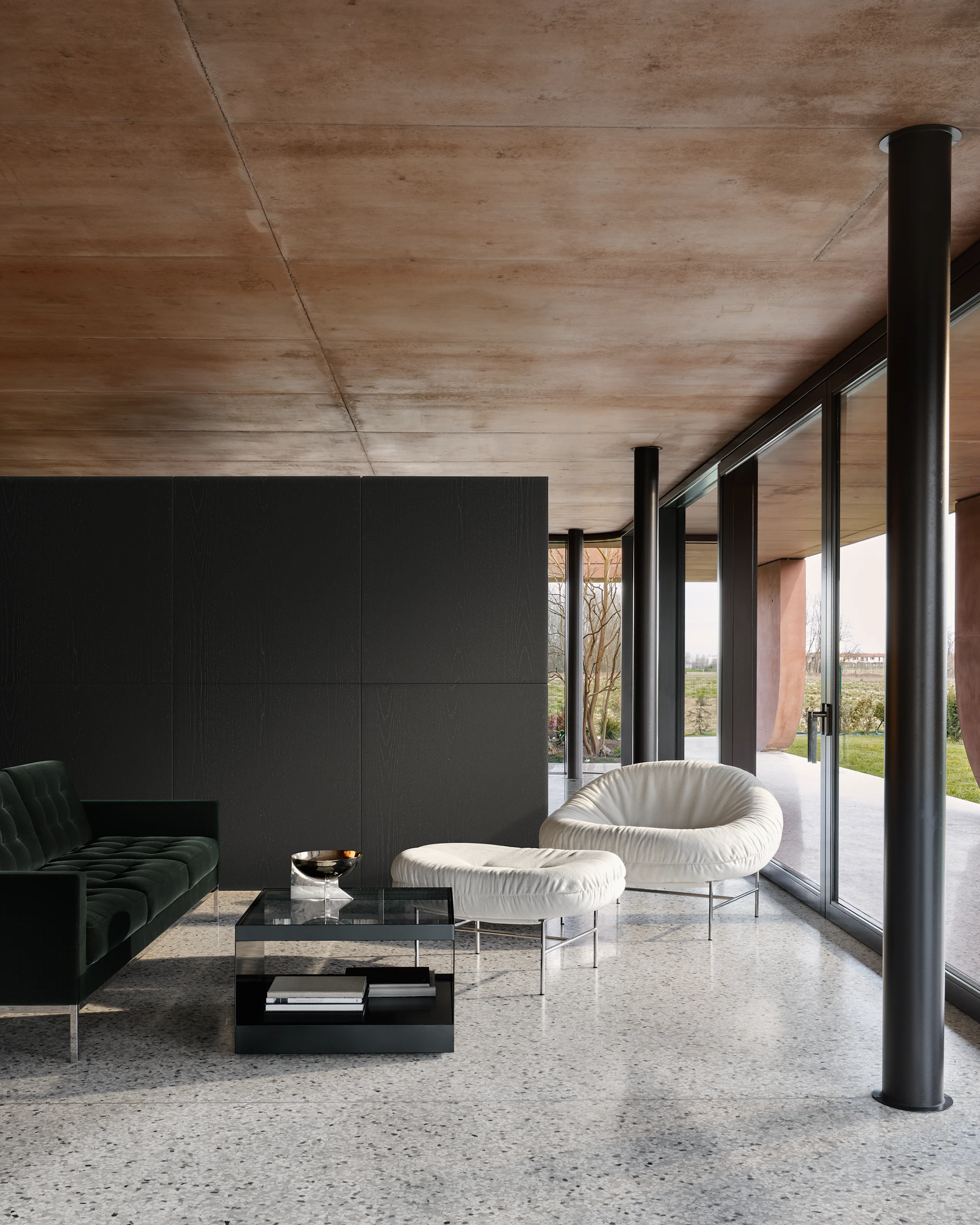 Bun Lounge Chair and Ottoman in Haven Ivory, Florence Knoll Sofa in Iseo Dark Green and D'Urso Coffee Table