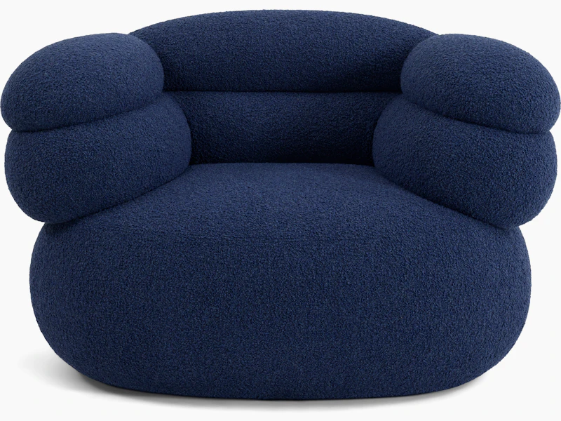 A Biboni Lounge Chair in Solid Sublime, Navy viewed from the front.