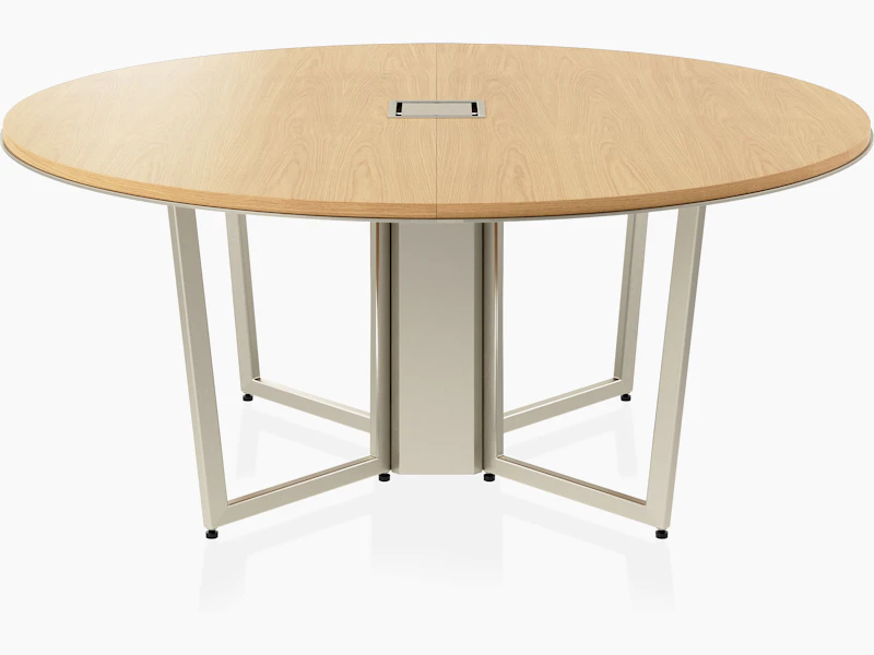 Circular Highline Meeting Table in Natural Flat Cut Oak with a Satin Nickel wire management base viewed from the front.