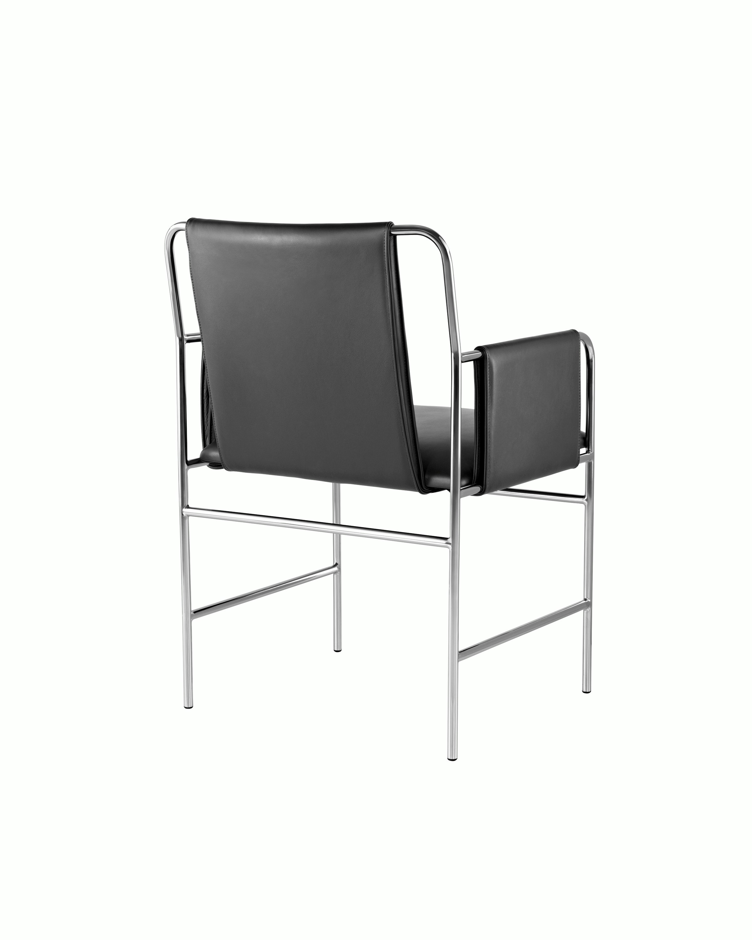 An Envelope side chair with black leather upholstery and a tubular steel frame, viewed from behind at an angle.