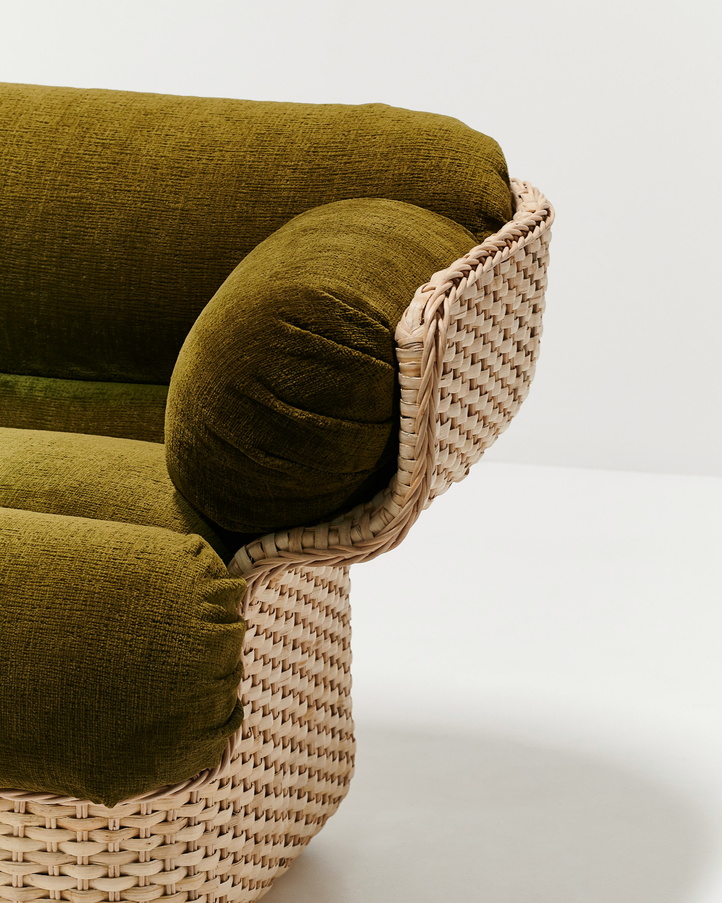 A detailed look at Basket Lounge Chair in Moss, Rattan.