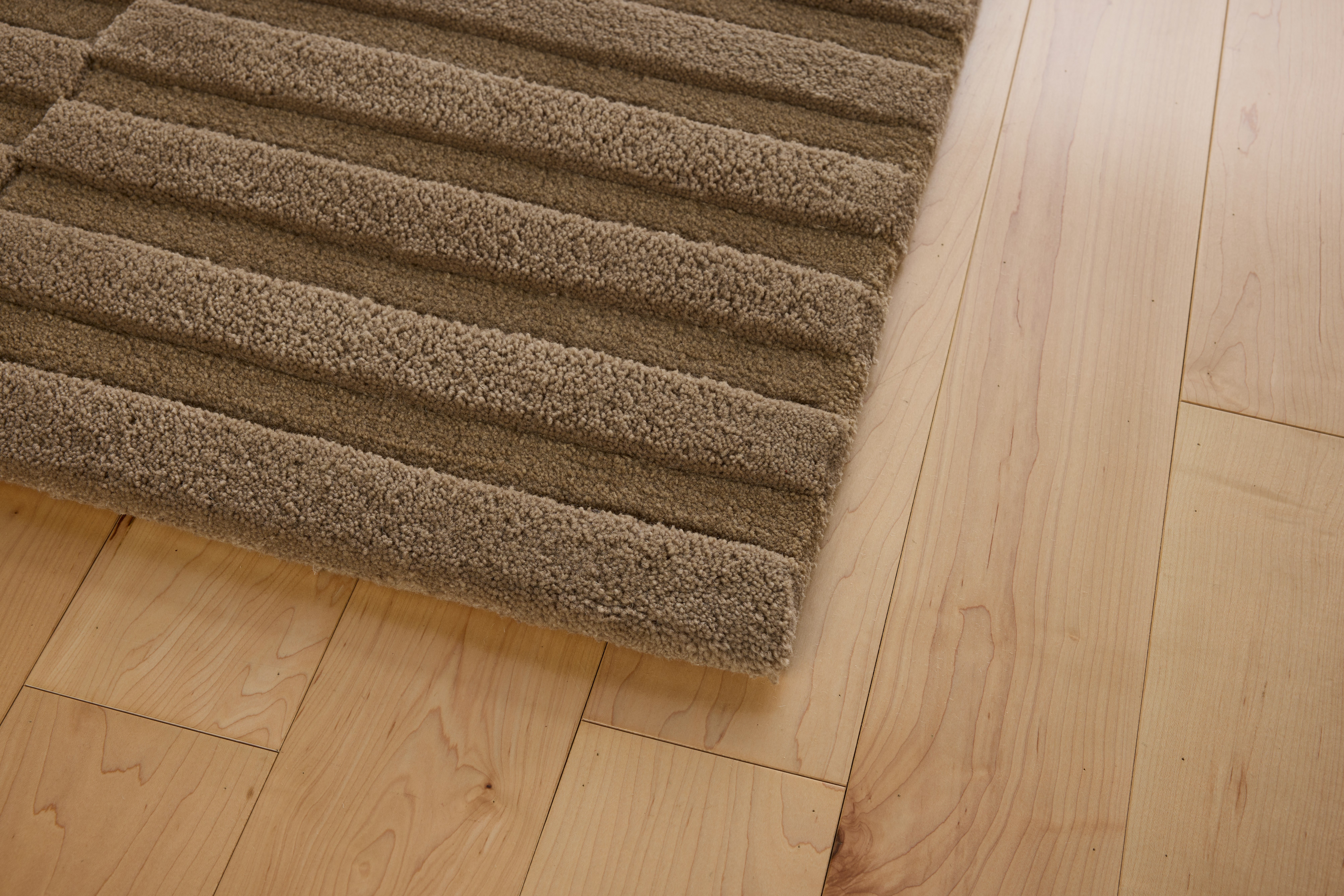 A detailed look at a Fog Bank Rug in Sand.