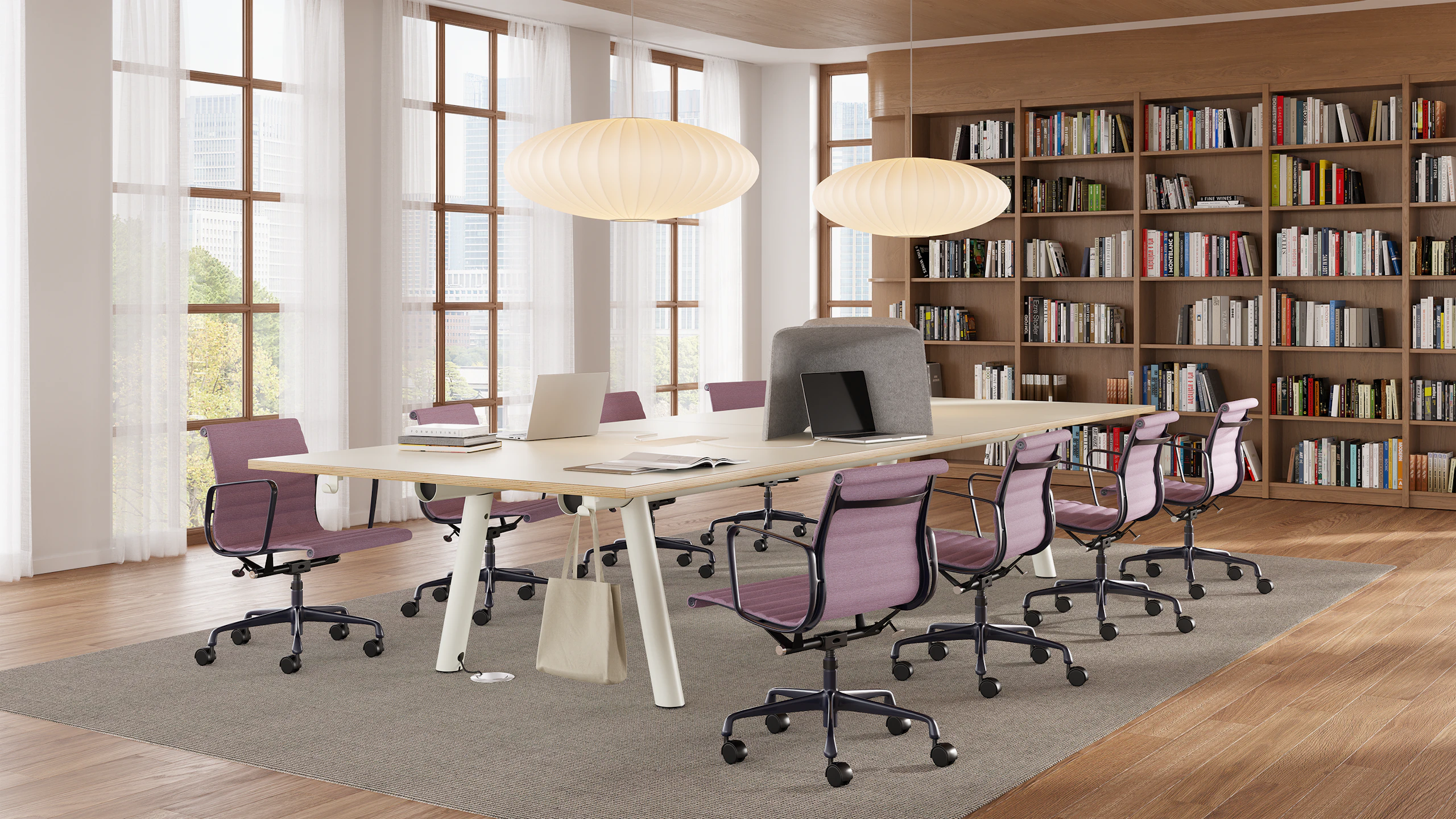 Rectangular Boa Table, seated height, oak top, white base, in a library setting with Eames Aluminum Group chairs.