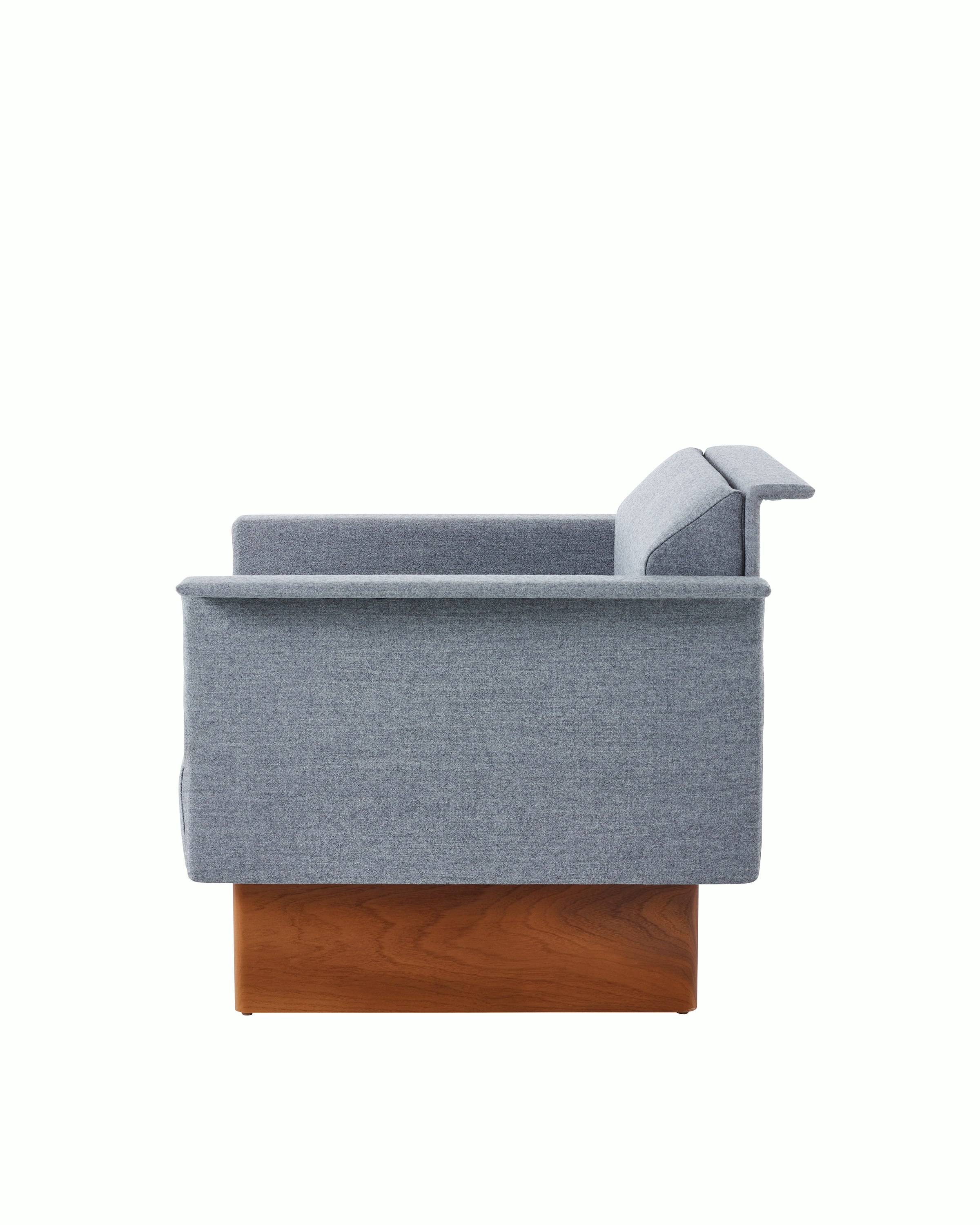 Mantle Club Chair in Panno di Dulce Flannel with a Walnut Base, viewed from the side.