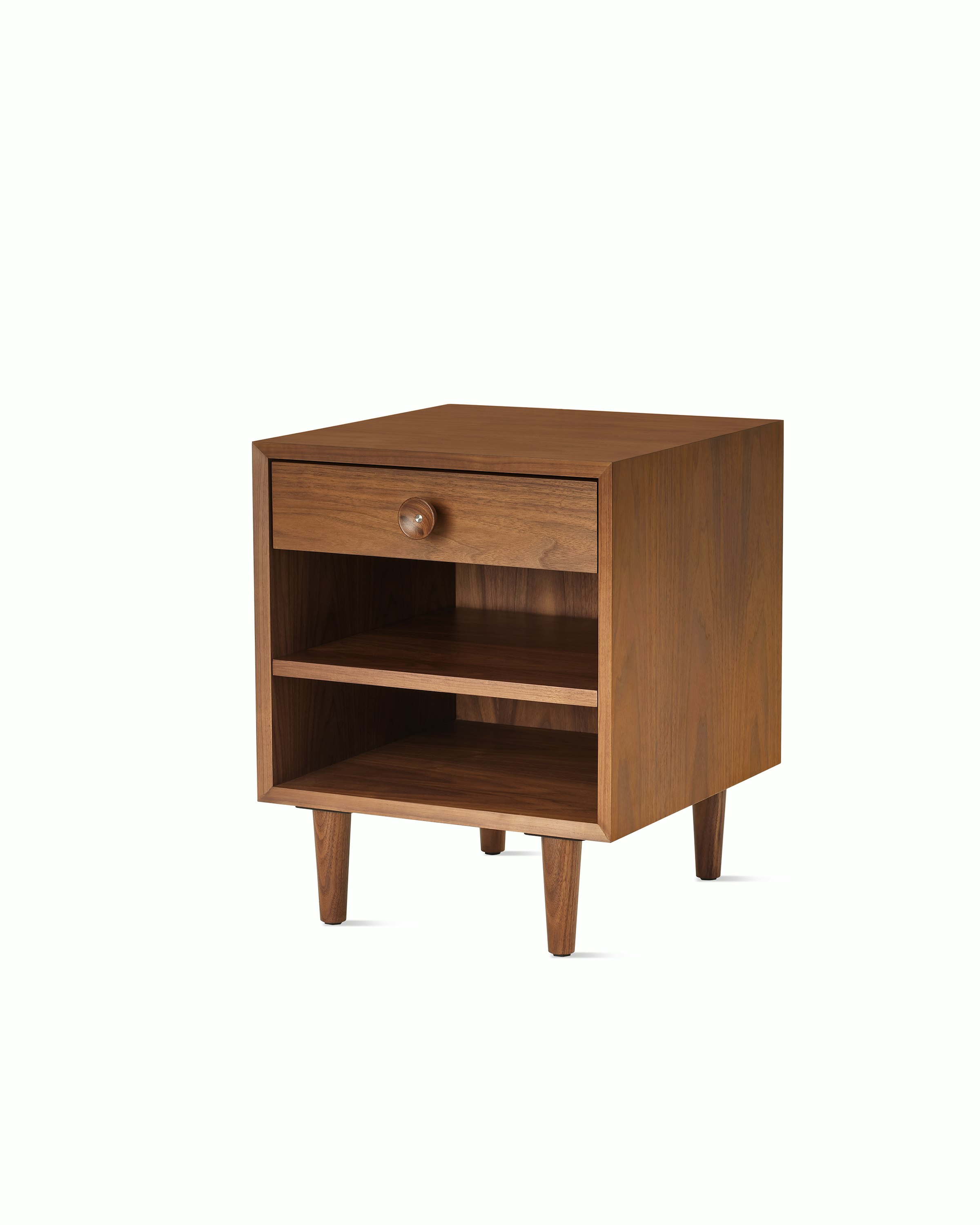 Nelson Basic Cabinet Series Bedside Table with one drawer, cupcake pull, open shelf, taper legs, in walnut.