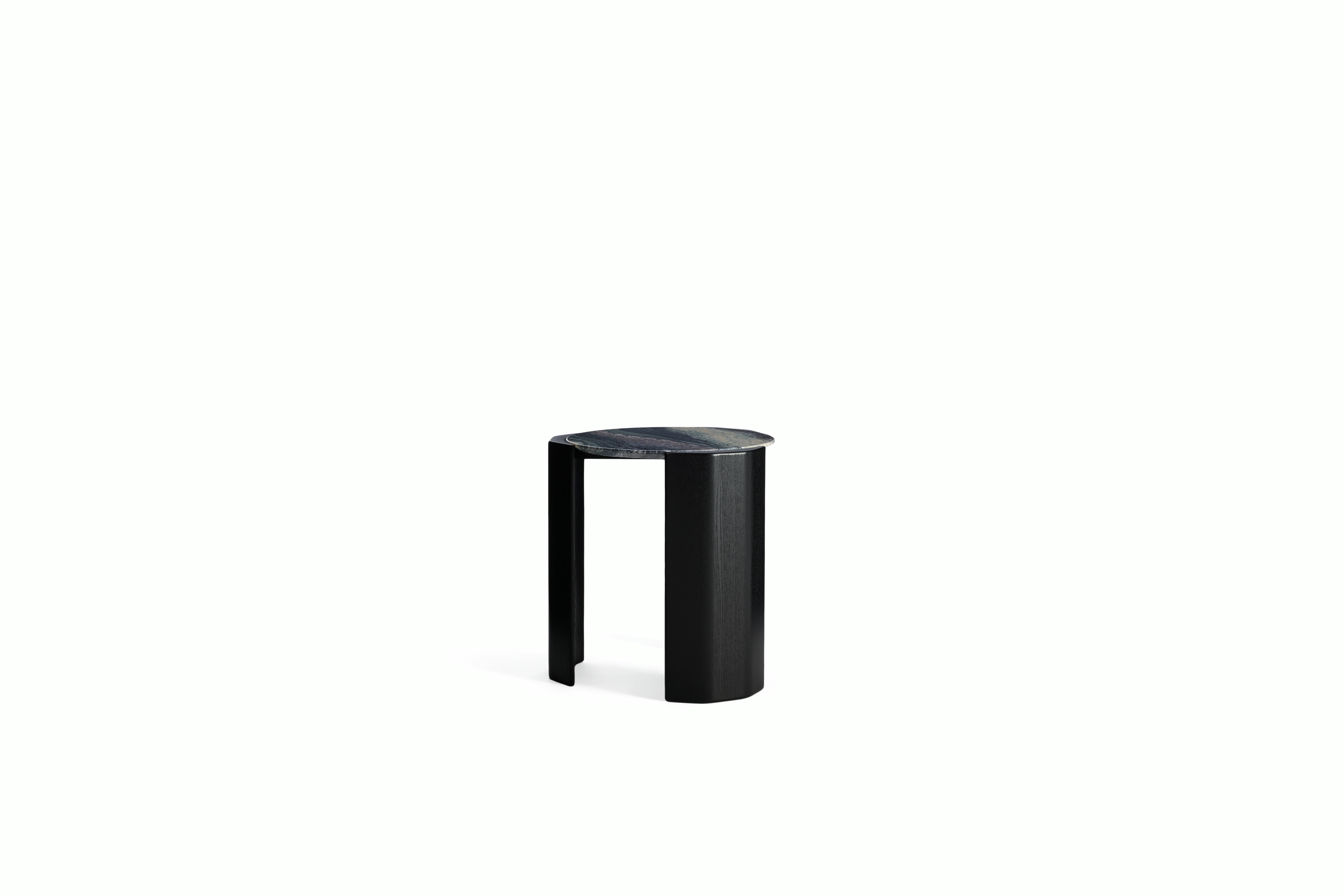 A Atlason Organic Slab Side Table in Black Ash viewed from an angle.