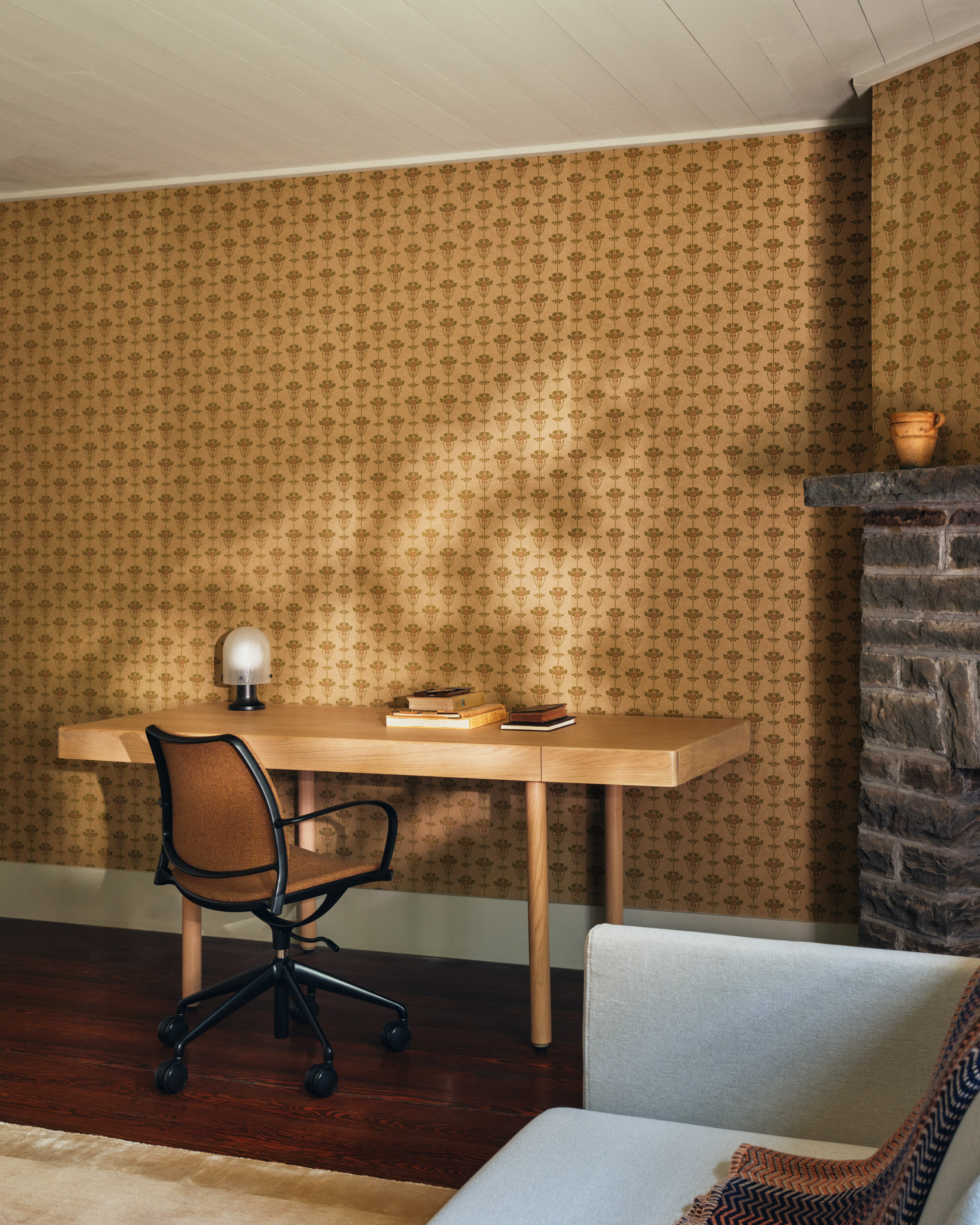 New Canaan Wood Desk in oak with Gas Task Chair in brown in a home office setting