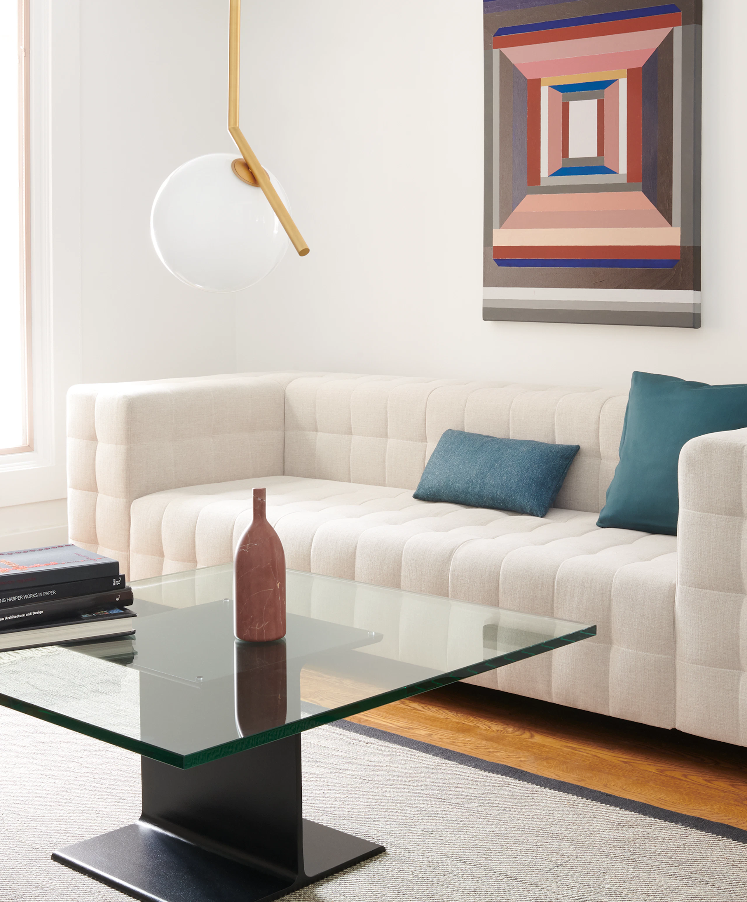 A lounge area featuring a Rapport Sofa and I Beam Table.