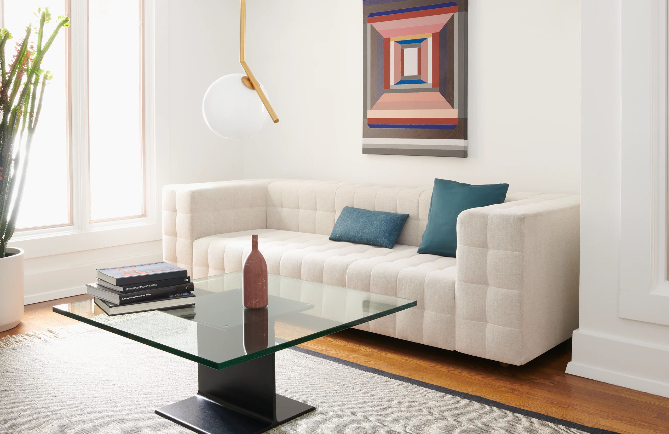 A lounge area featuring a Rapport Sofa and I Beam Table.