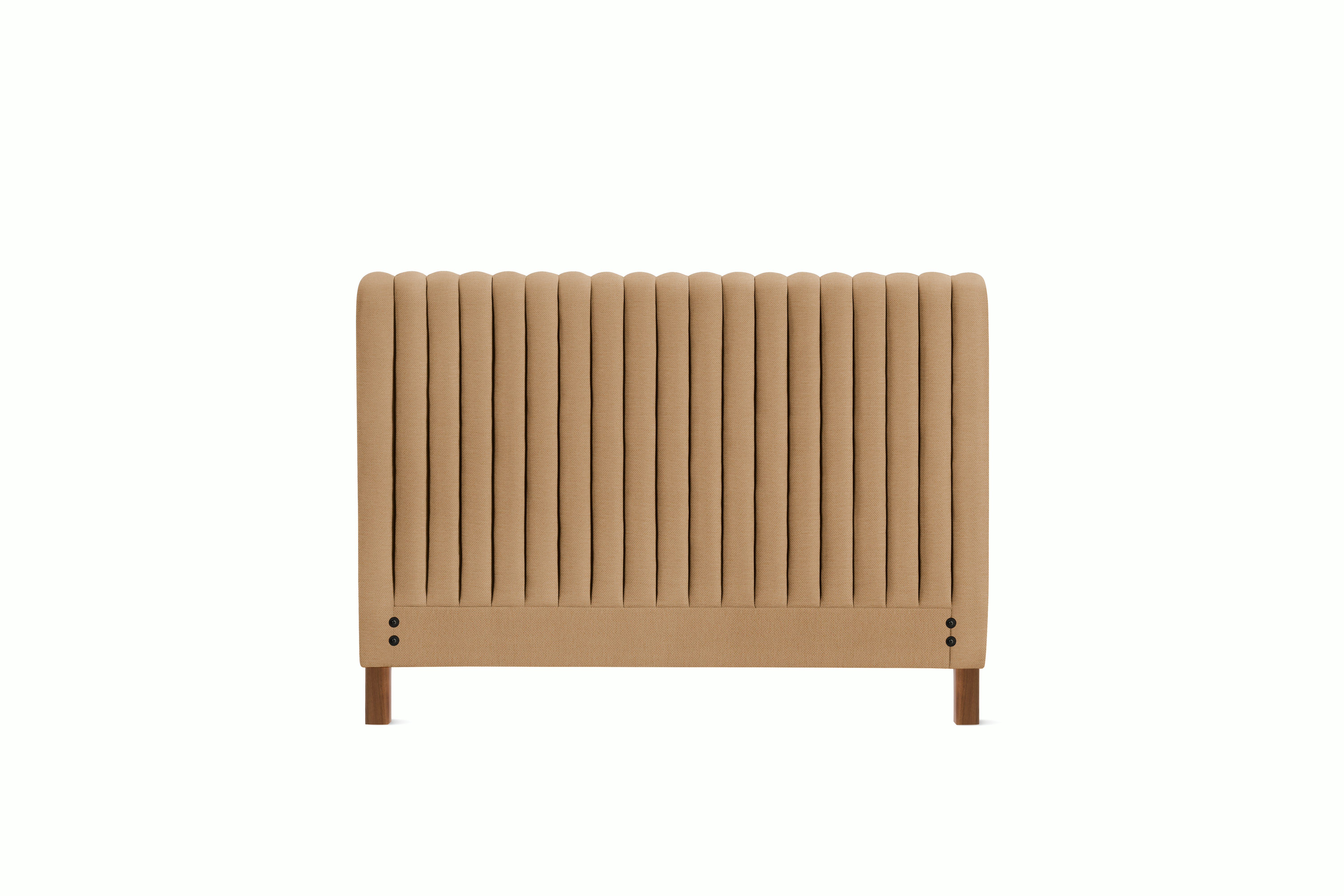 A Charlotte Headboard in Camel viewed from an angle.