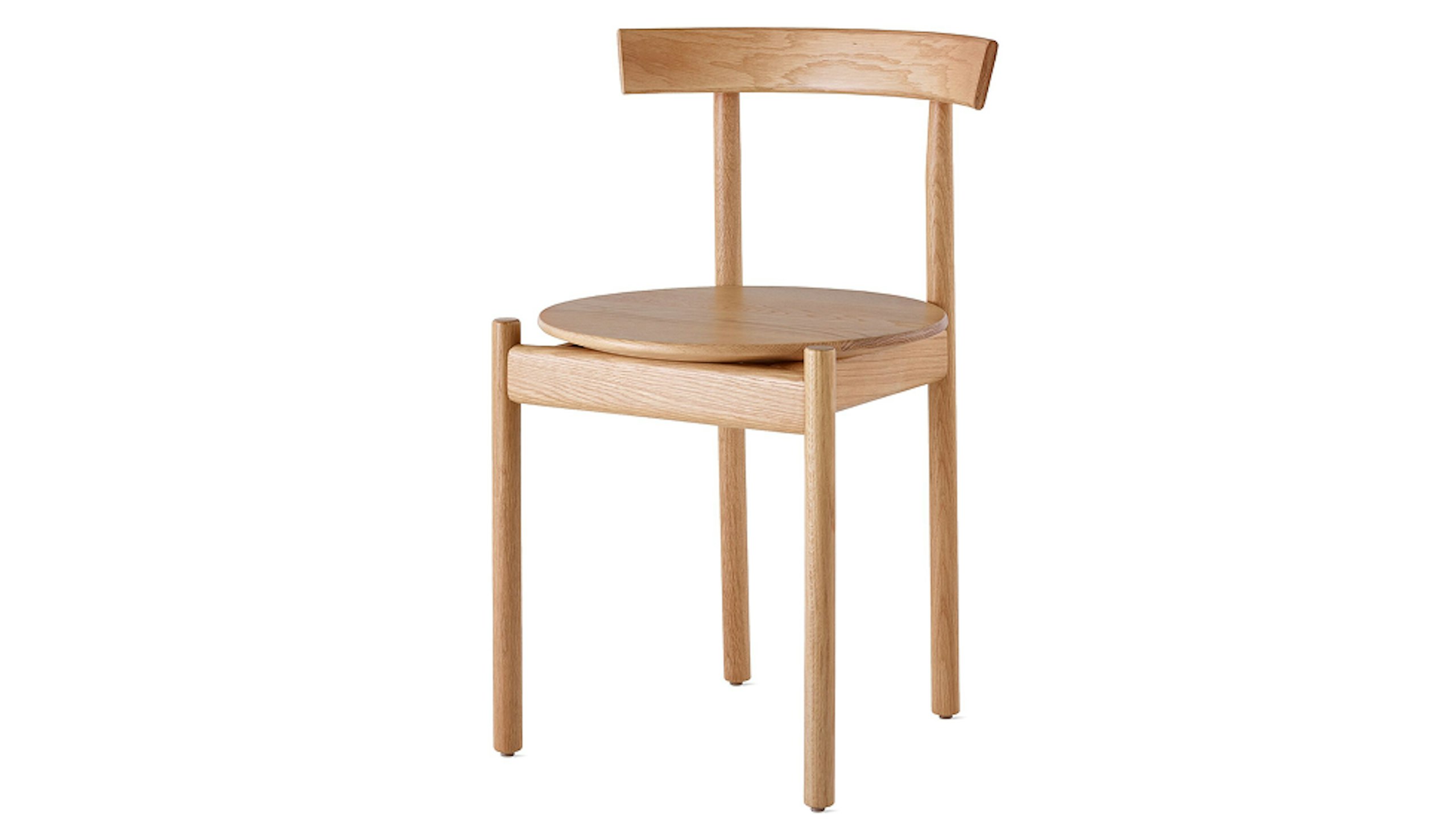 白色背景上配有 Herman Miller 出品的浅色木质 Comma 座椅