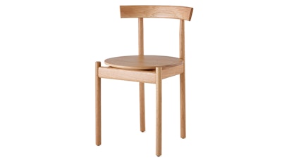A light wood finish Comma Chair by Herman Miller on a white background