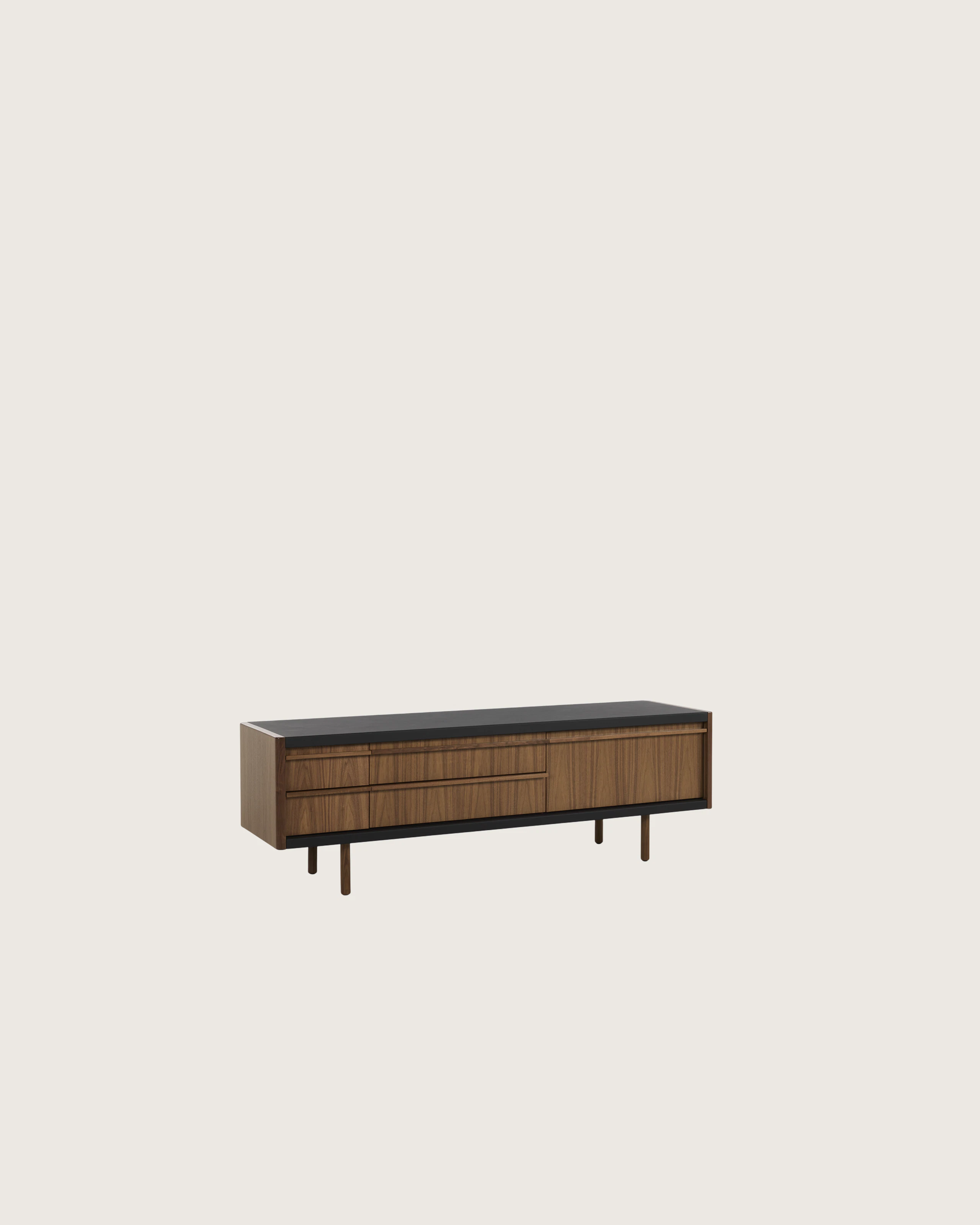 New Canaan Media Unit designed by BassamFellows for Geiger in Walnut with Black Leather shown angled on a white sweep.