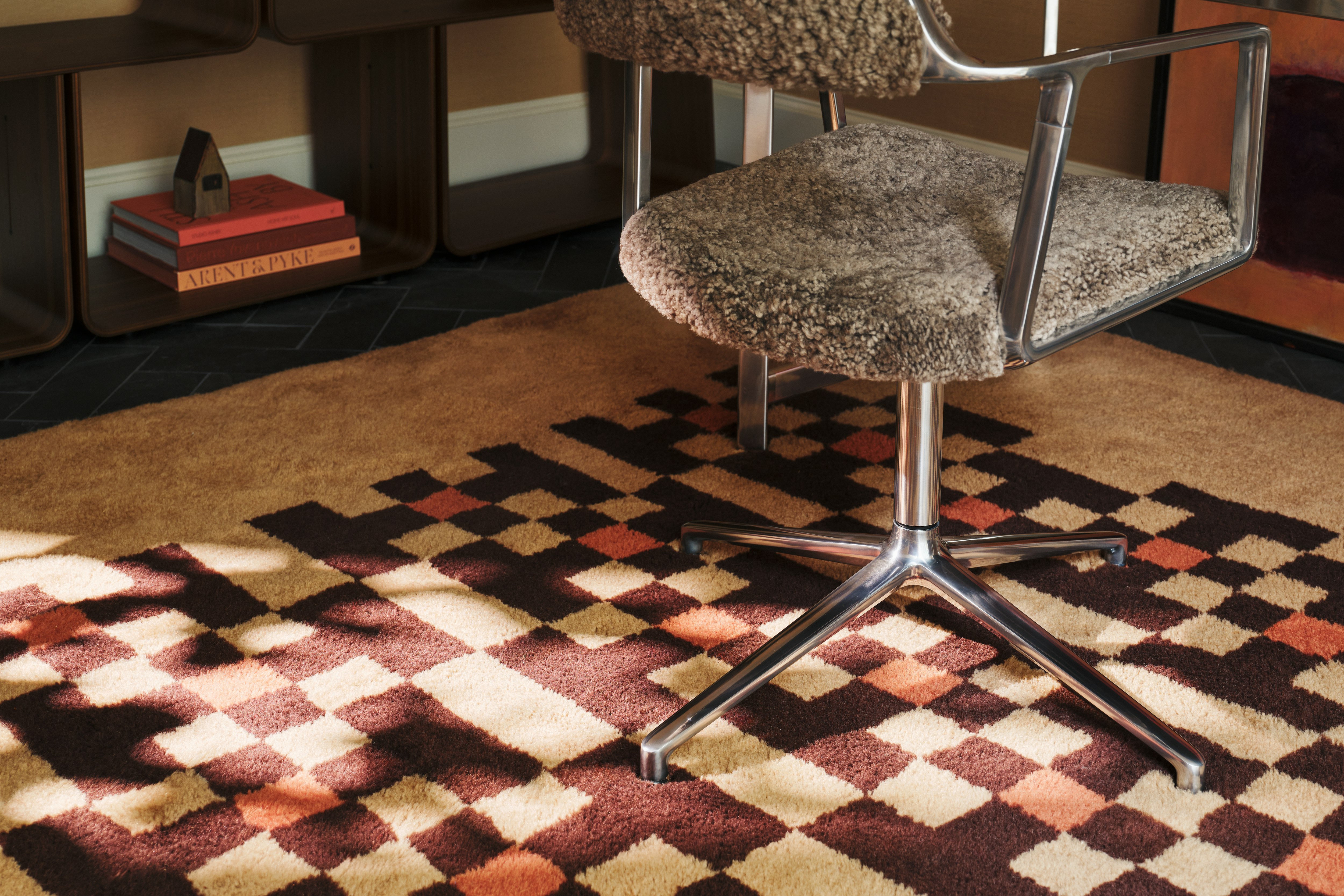 Vipp452 Swivel Chair in Curly and polished frame in a home office