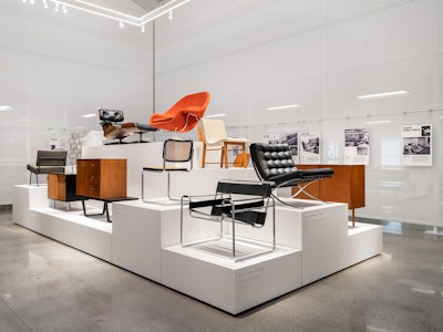 Iconic furntiure from the MillerKnoll Collective, such as the Knoll Barcelona Chair, Knoll Womb Chair, and Eames Lounge Chair and Ottoman, on display at the MillerKnoll Archives
