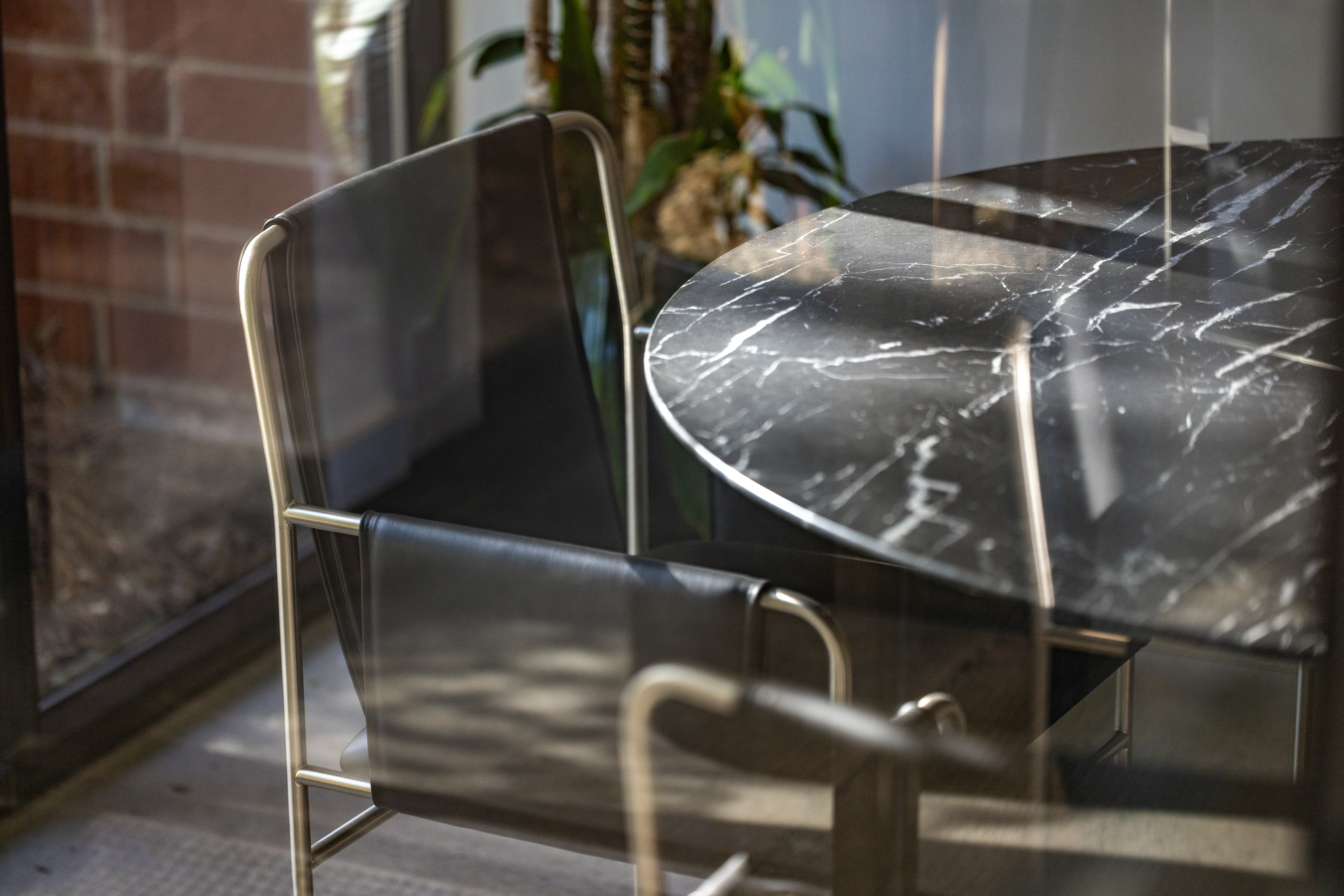 Image of an office space through a window from the Geiger Atlanta Manufacturing Facility.