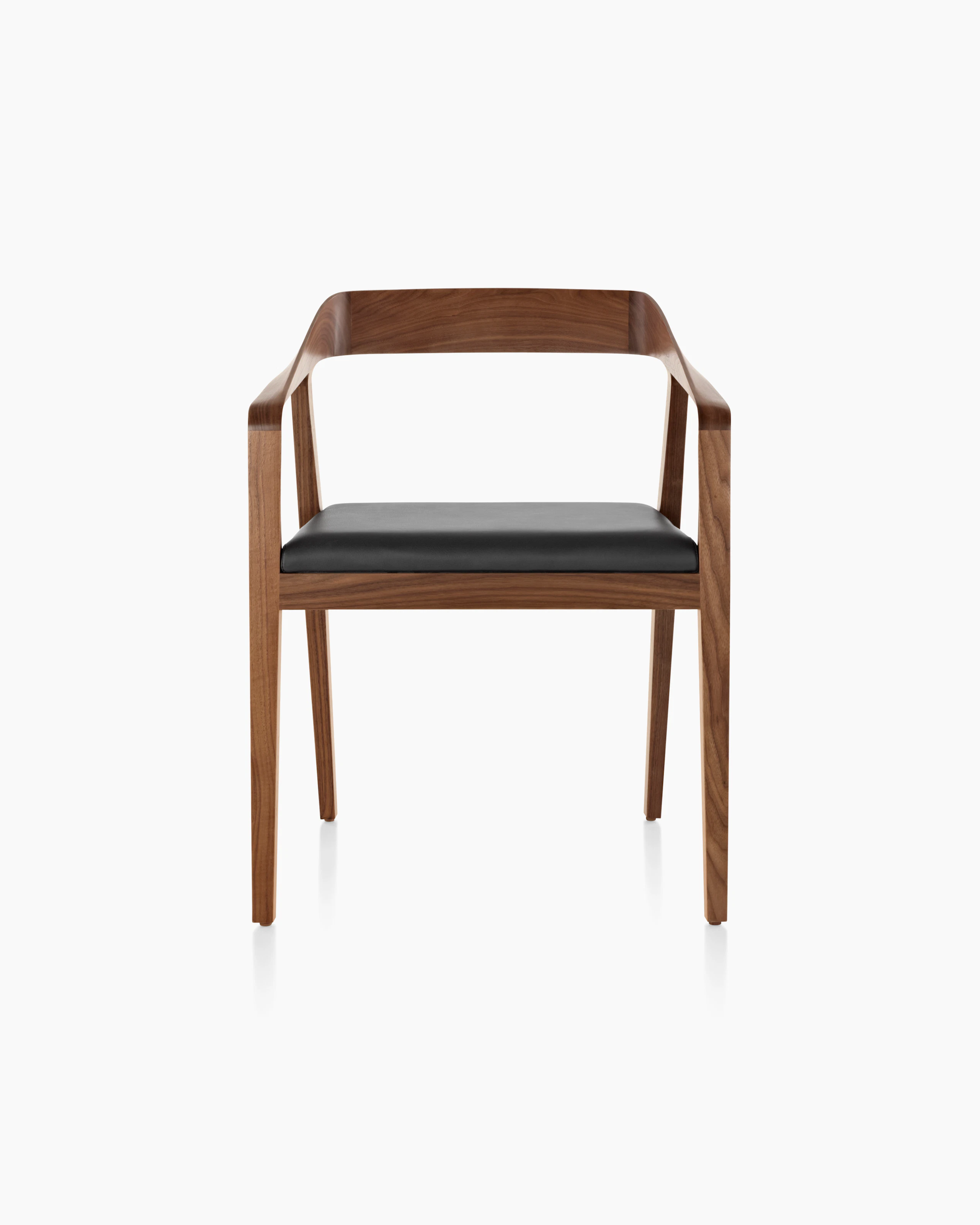 A Full Twist Guest Chair with a black leather seat pad and a wood frame in a medium finish, viewed from the front.