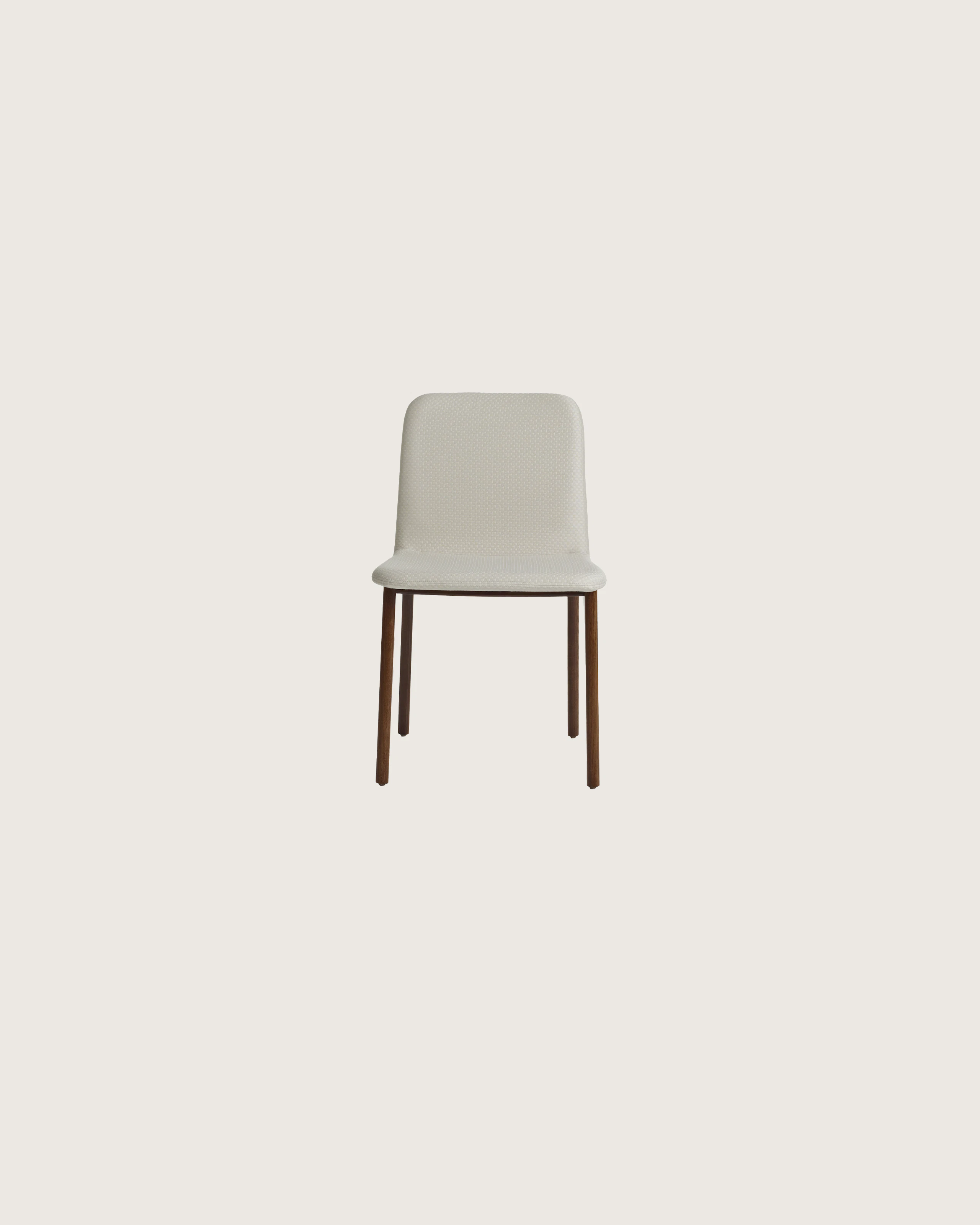 A Deft side chair with ivory-colored fabric, a wood frame in a medium finish, and no arms, viewed from the front.