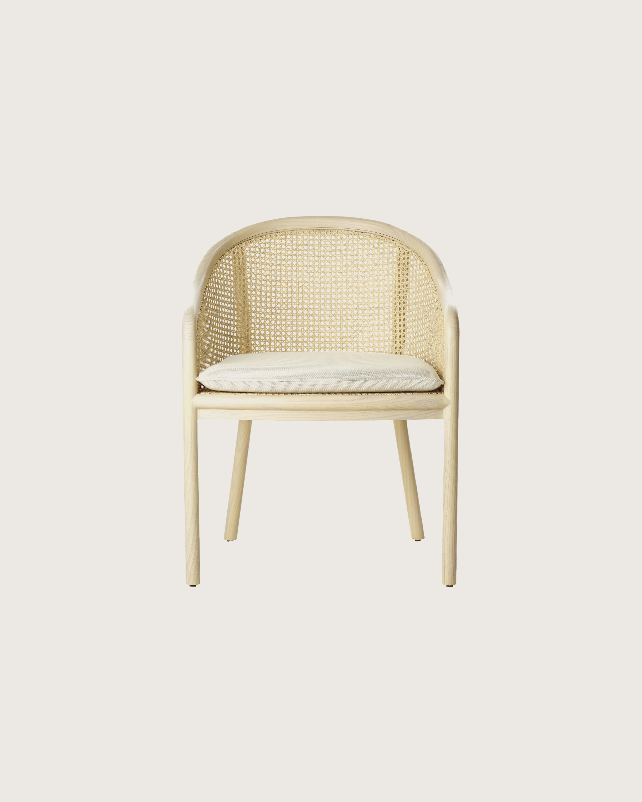 Landmark Chair with a cane back and a seat upholstered in a Double Beam textile, viewed from the front.