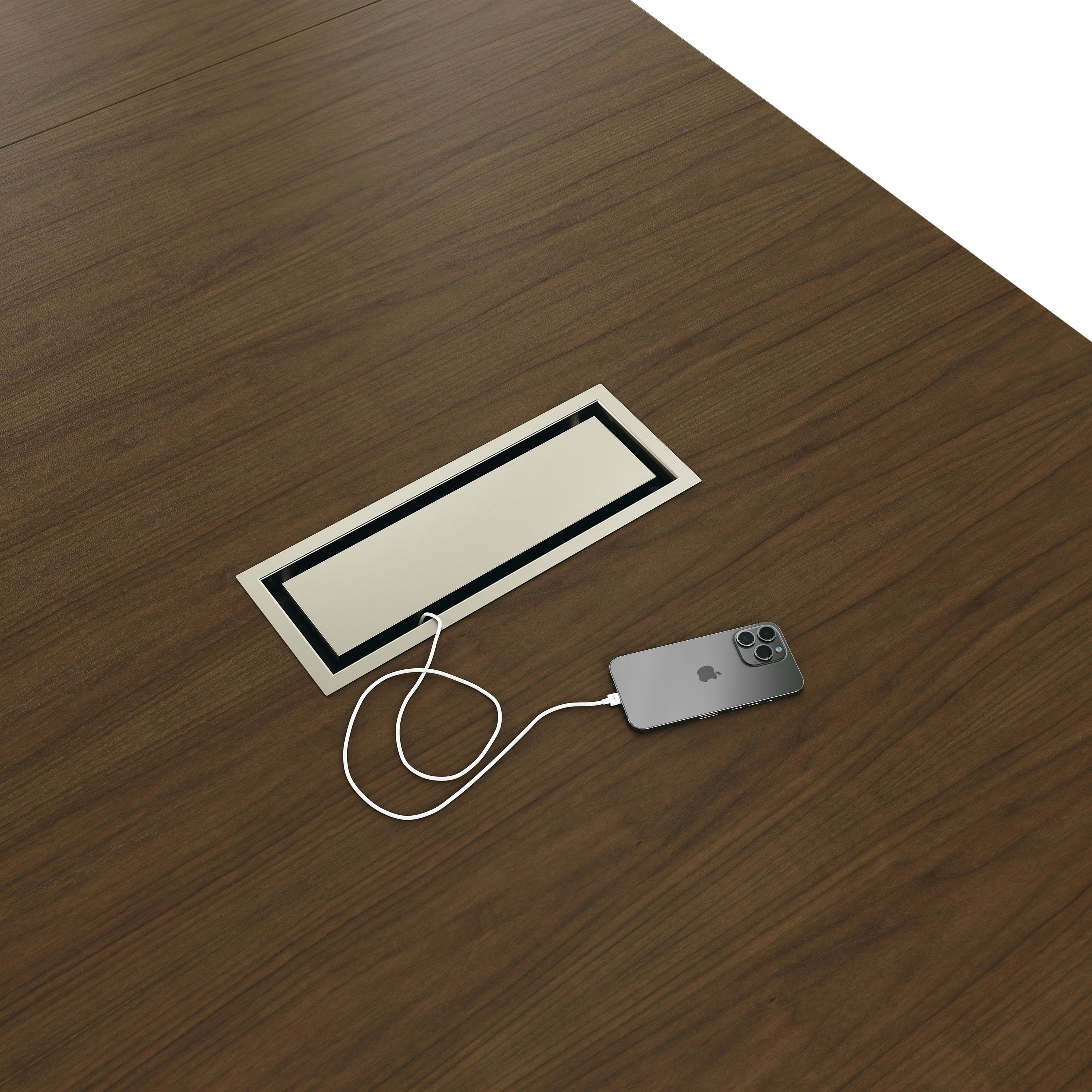 Detail shot of closed tabletop power access Highline Conference Table in Cashmere Flat Cut Walnut with Satin Nickel details.