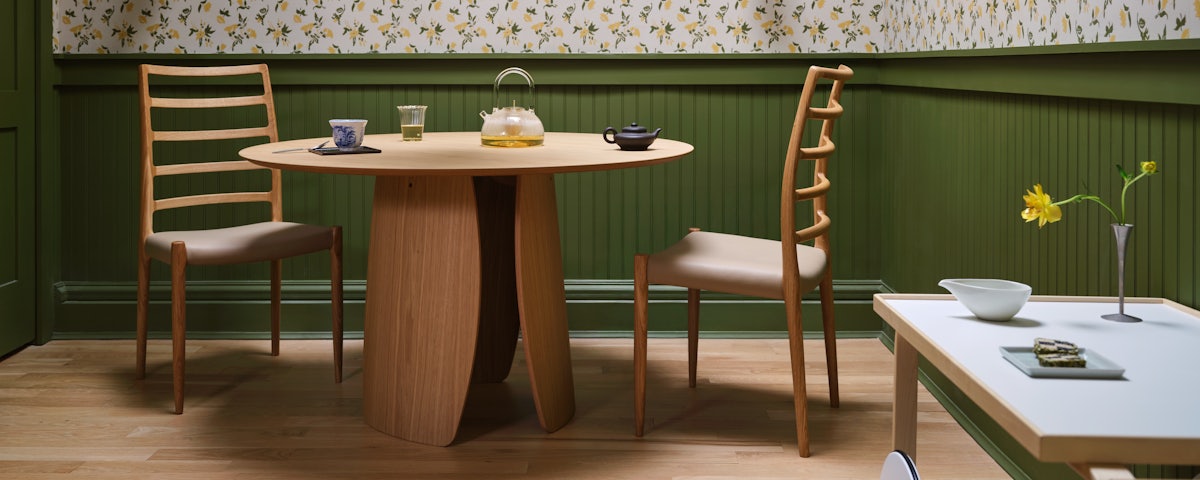 Lorea Dining Table and two Moller 82 Side Chairs in a dining room setting