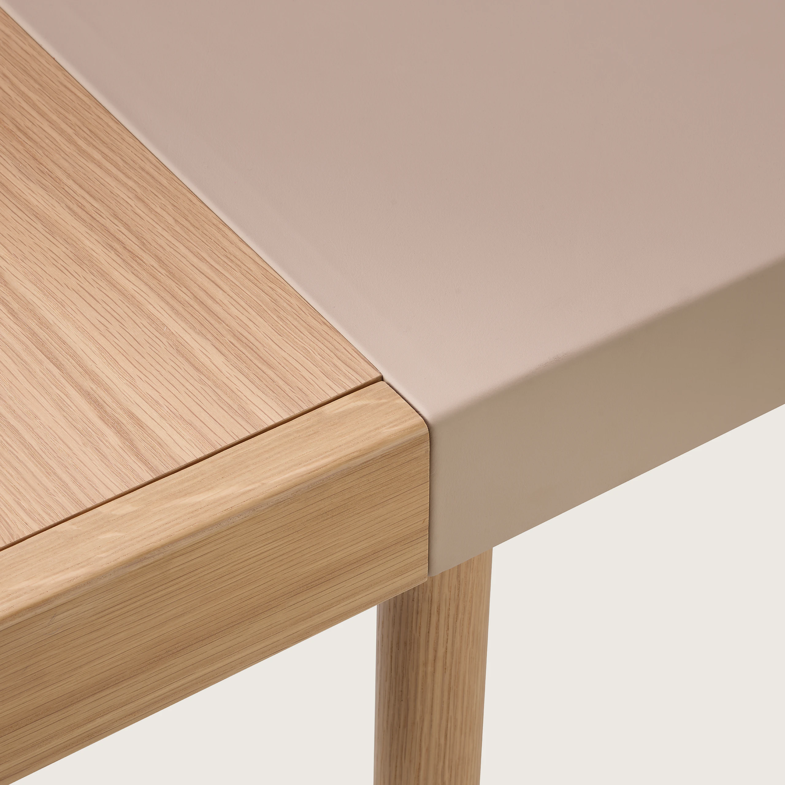 New Canaan Leatherwrap Sit-to-Stand Desk in Oak and Champagne Leather, detail showing seamless blending of Leather, Solid Wood and Veneer.
