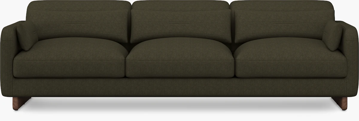 Three-seat sofa side view with three back cushions and wooden legs