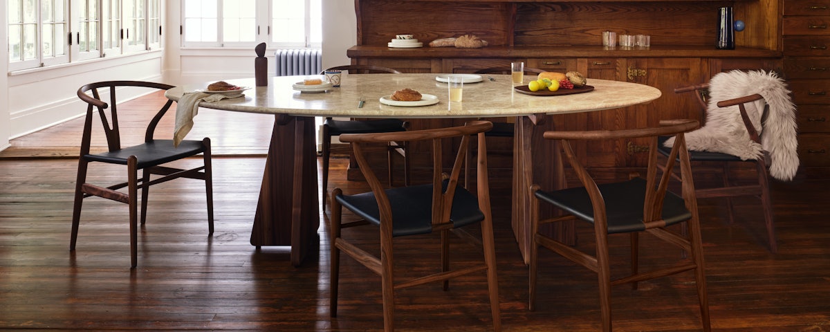 Pinna Dining Table with Wishbone Chairs in a dining room setting