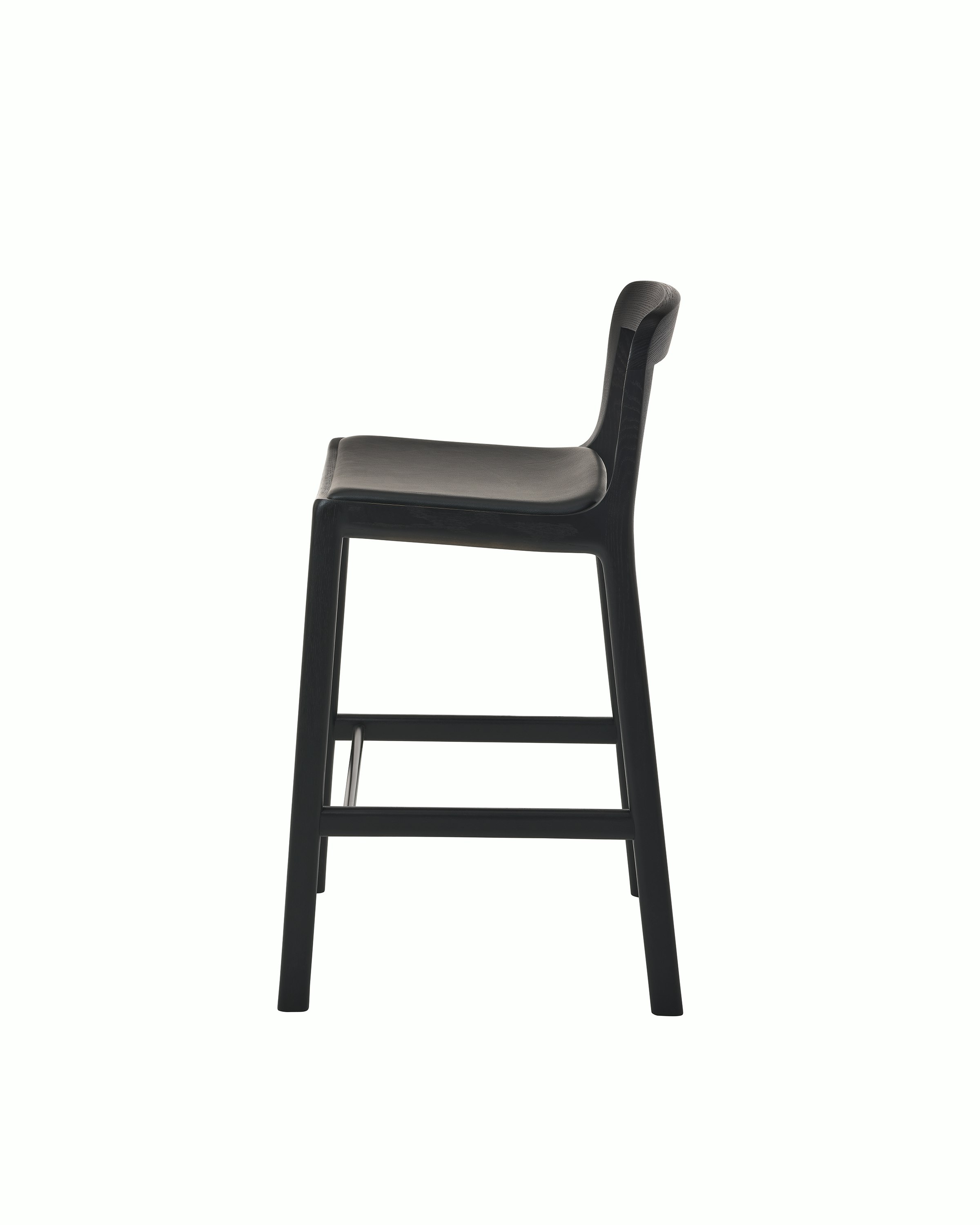 Lijn Stool by Carole Baijings for Geiger in Ebonized Oak frame upholstered with Maharam Prone Leather in Obsidian, side view on a white sweep.