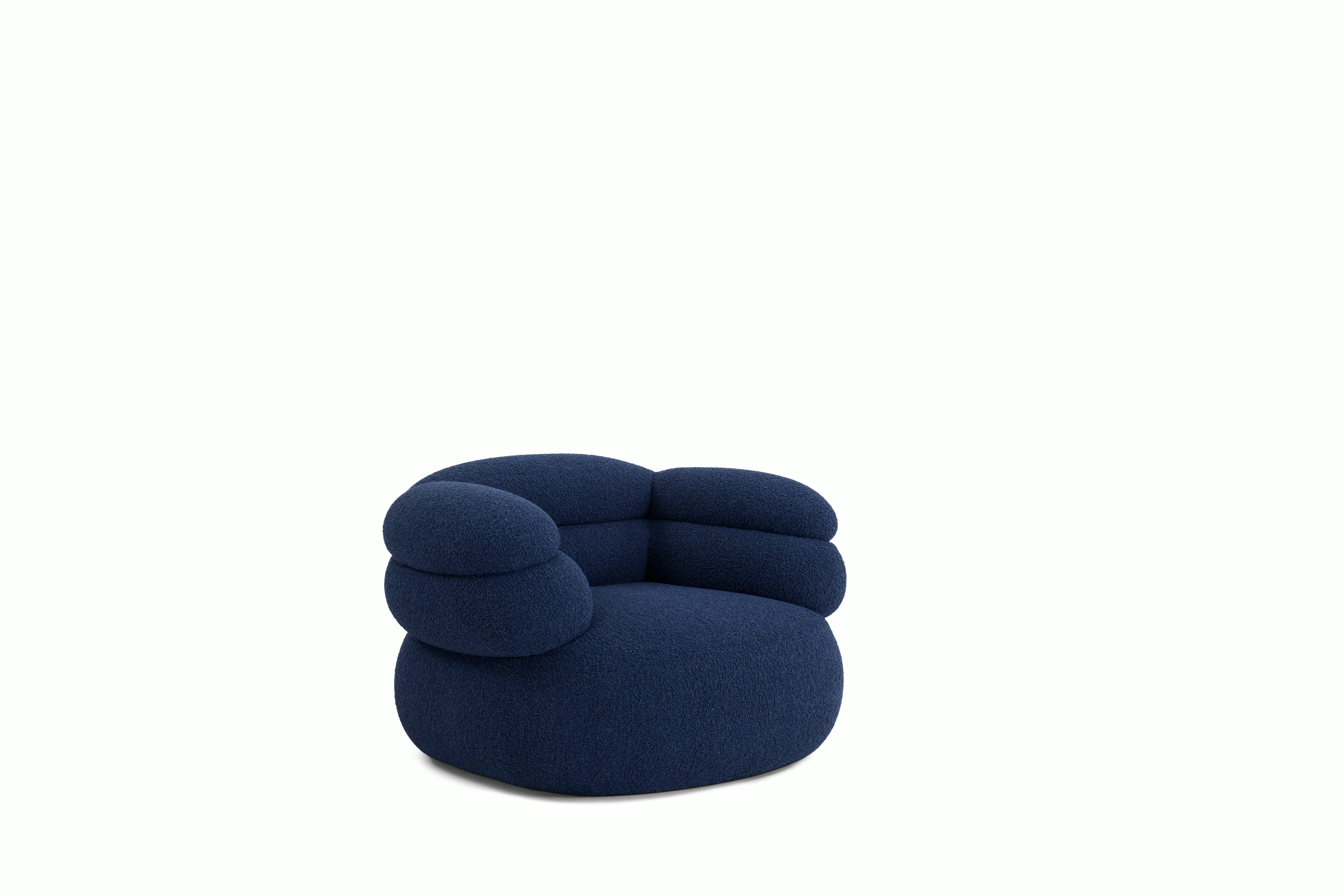 A Biboni Lounge Chair in Solid Sublime, Navy viewed from an angle.