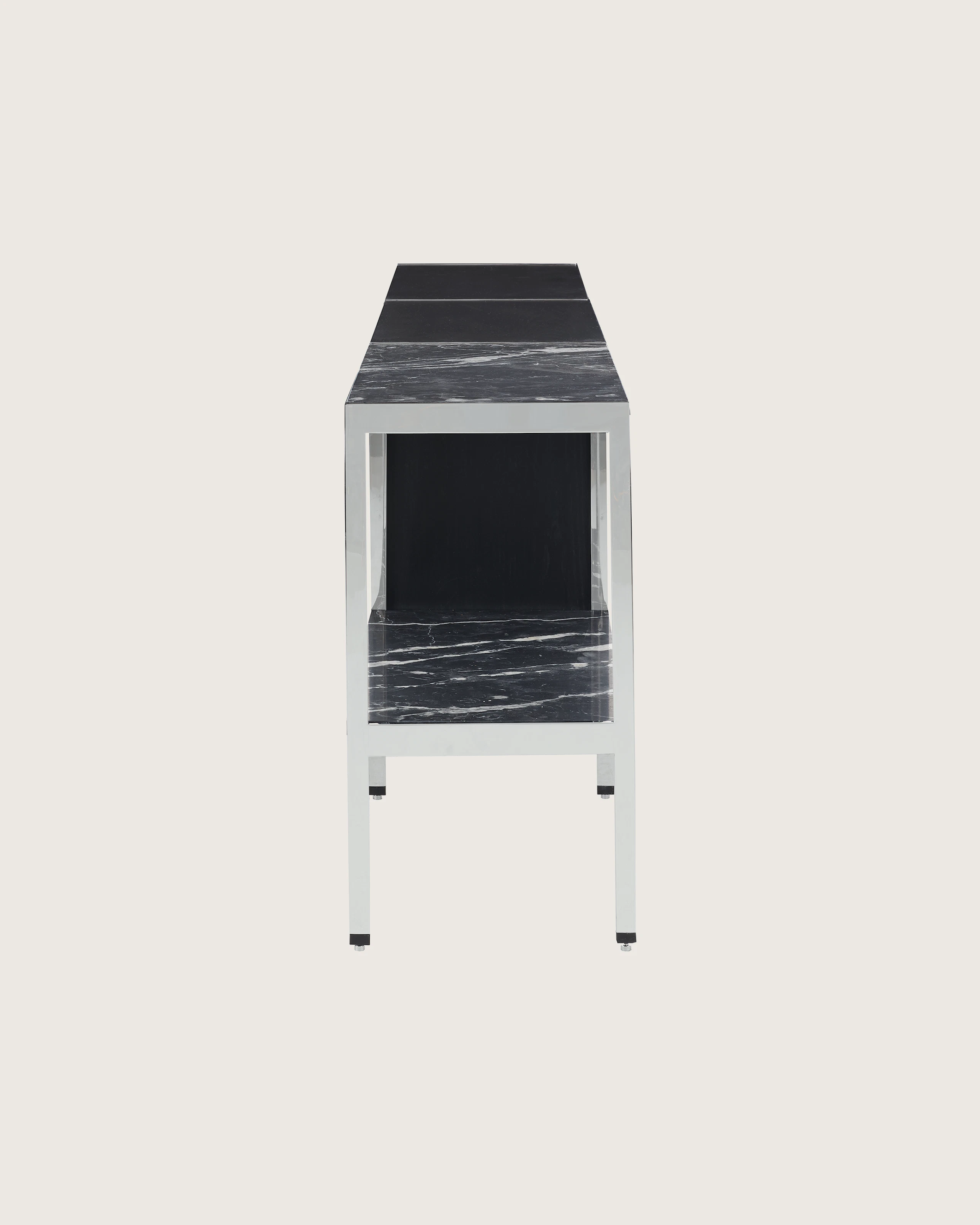 H Frame Storage designed by Ward Bennett in Ebonized Ash with a polished chrome frame and a Nero Marquina top and shelf, shown in profile on a white sweep.