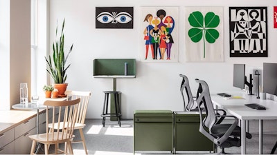 A sunlit office space featuring a variety of furniture from the MillerKnoll collective of brands such as Herman Miller Cosm Chairs, OE1 Storage Trolleys, and OE1 workstations