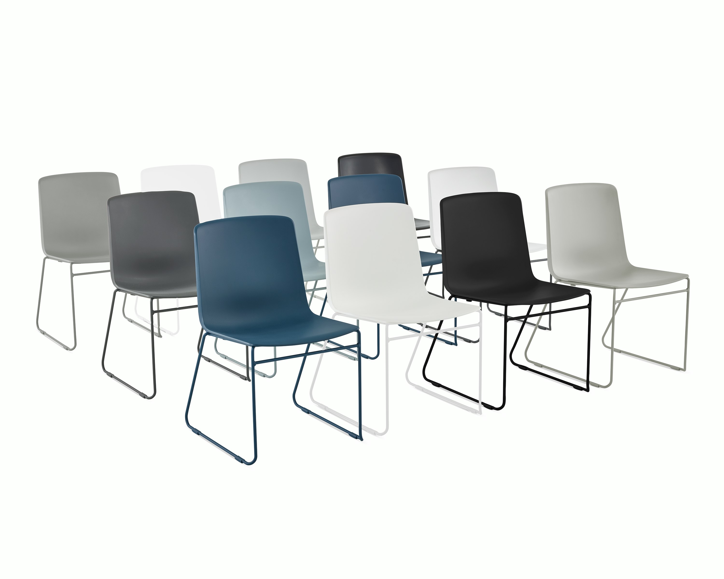 Three rows of multi colored Pronta Stacking Chairs.