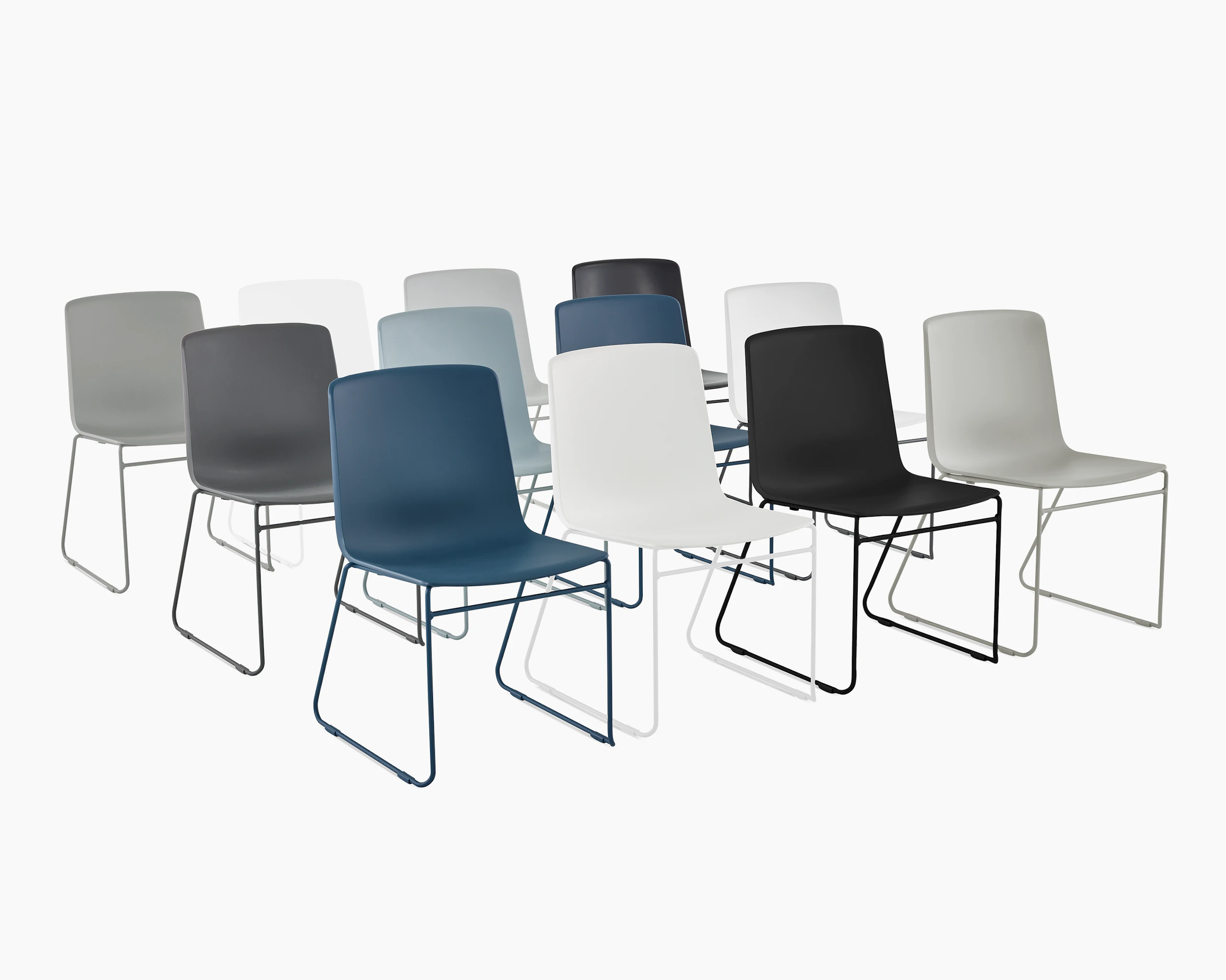 Three rows of multi colored Pronta Stacking Chairs.