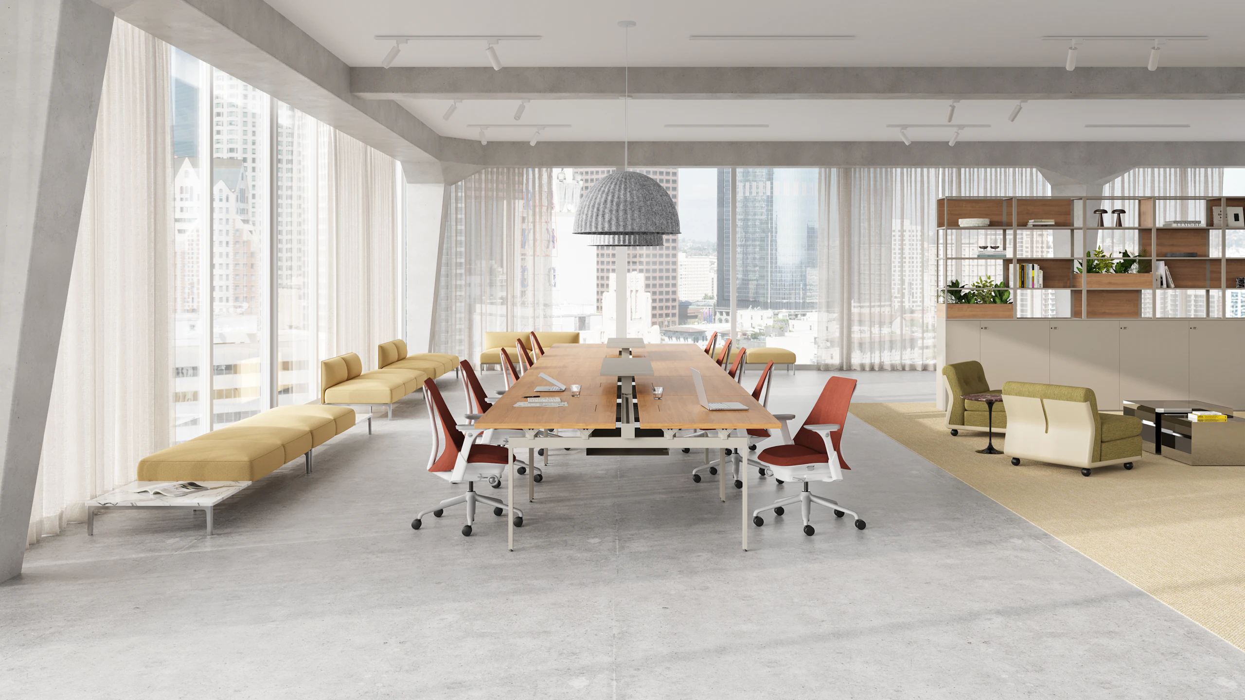 A open office setting in a metropolitan city with Knoll Antenna Big Table and Herman Miller Sayl chairs.