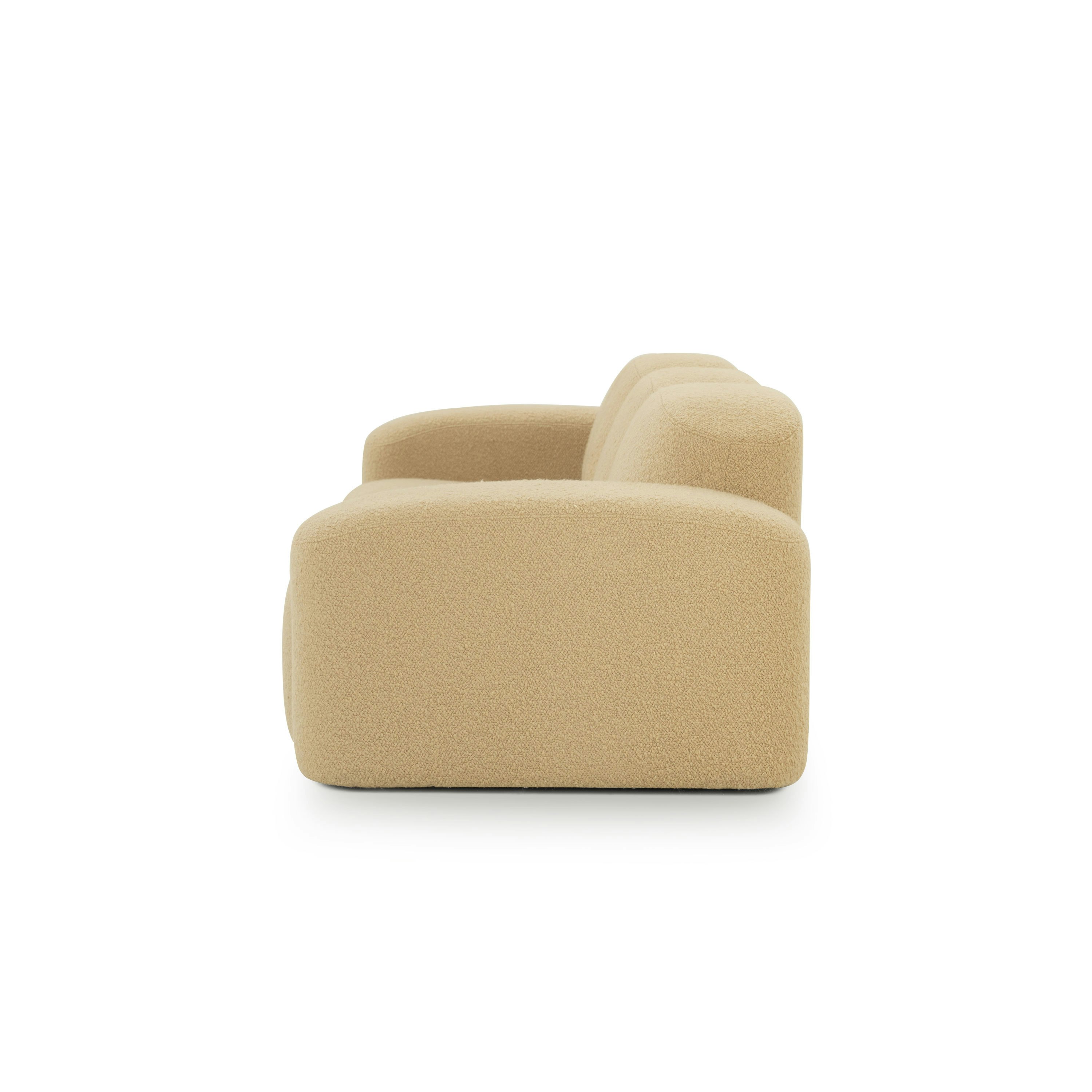 A Muse Sofa in Airlie: Camel viewed from the side.