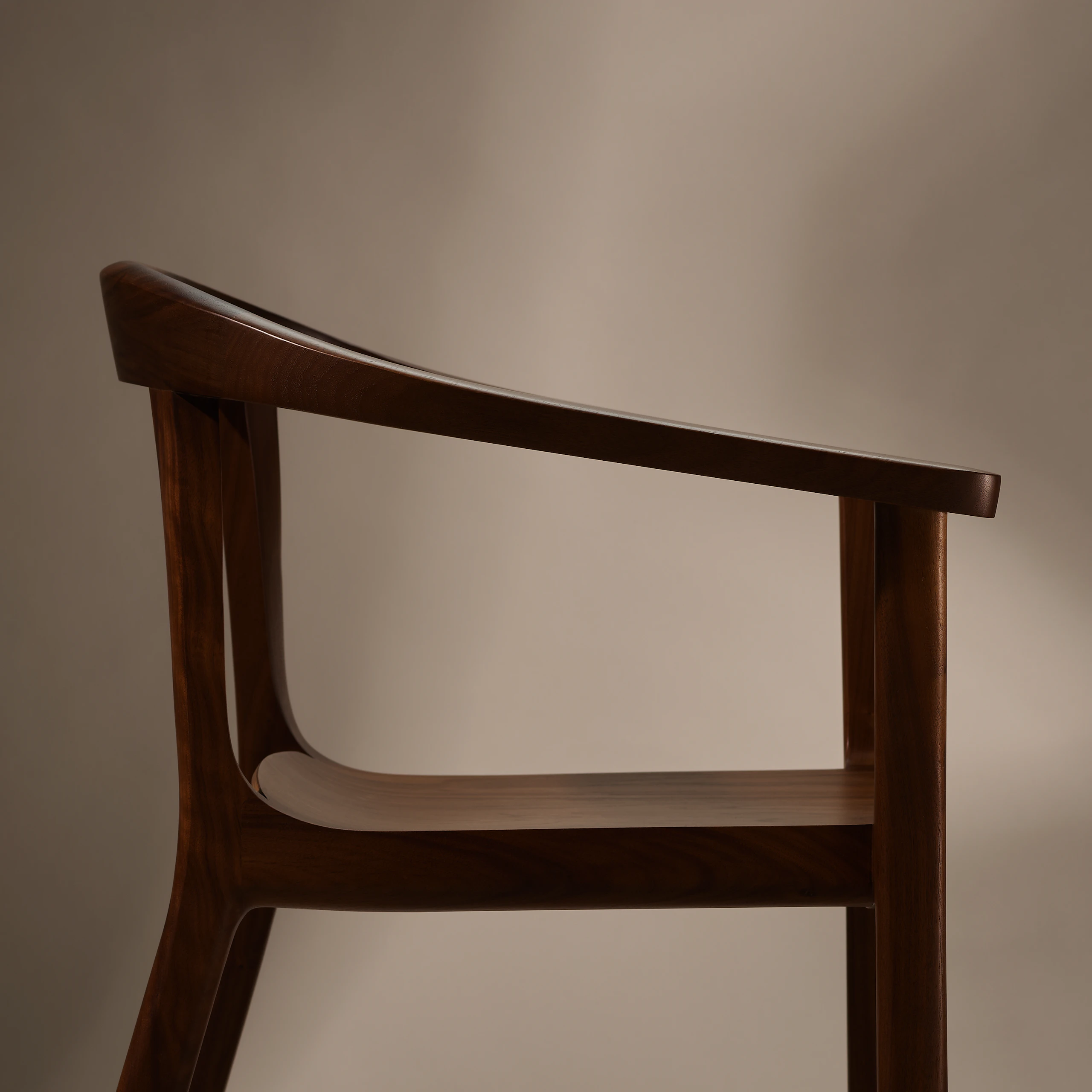 Lijn Armchair by Carole Baijings for Geiger in Persian Walnut frame, detail shot on a neutral background.