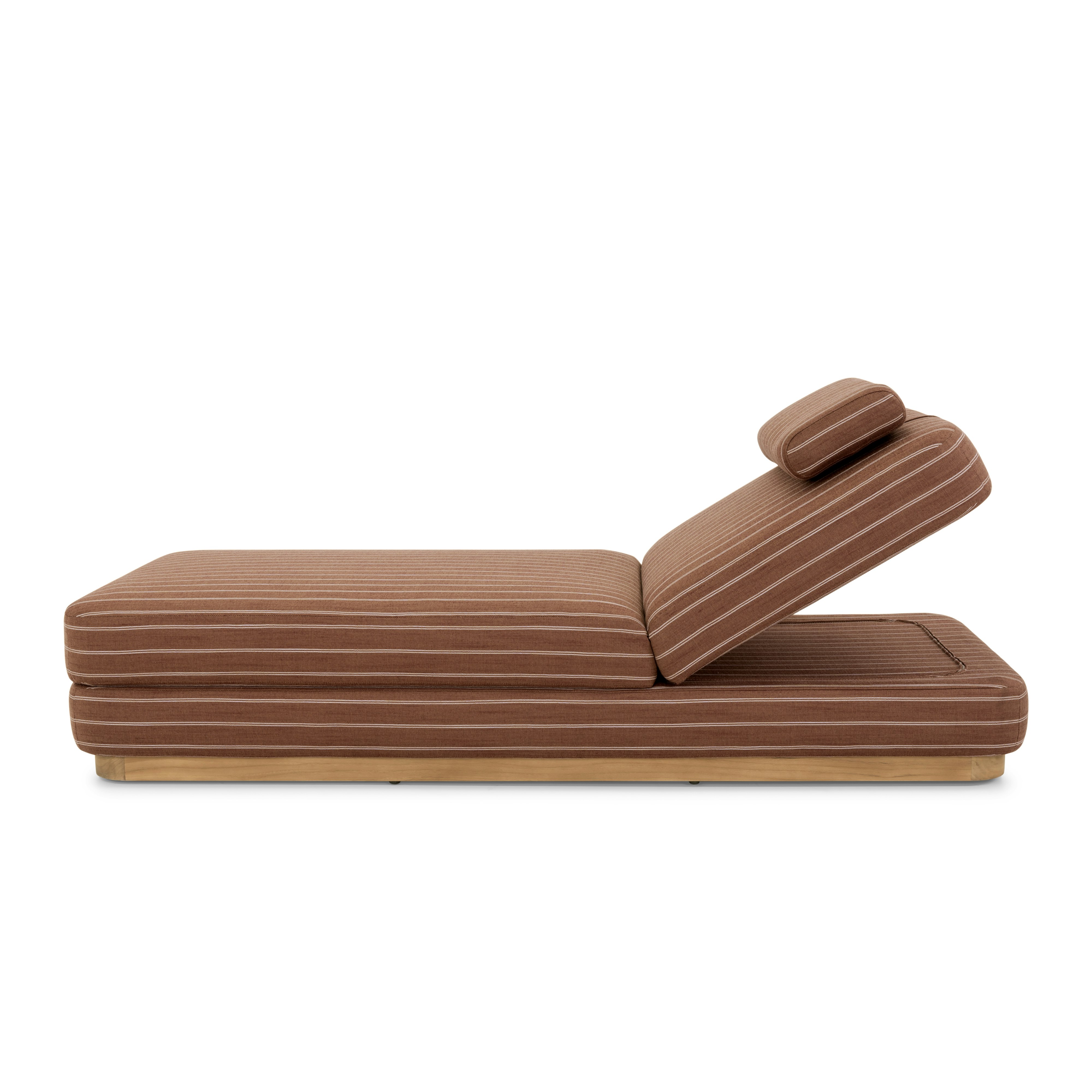 A Stack Outdoor Chaise in Terra Rossa viewed from the side.