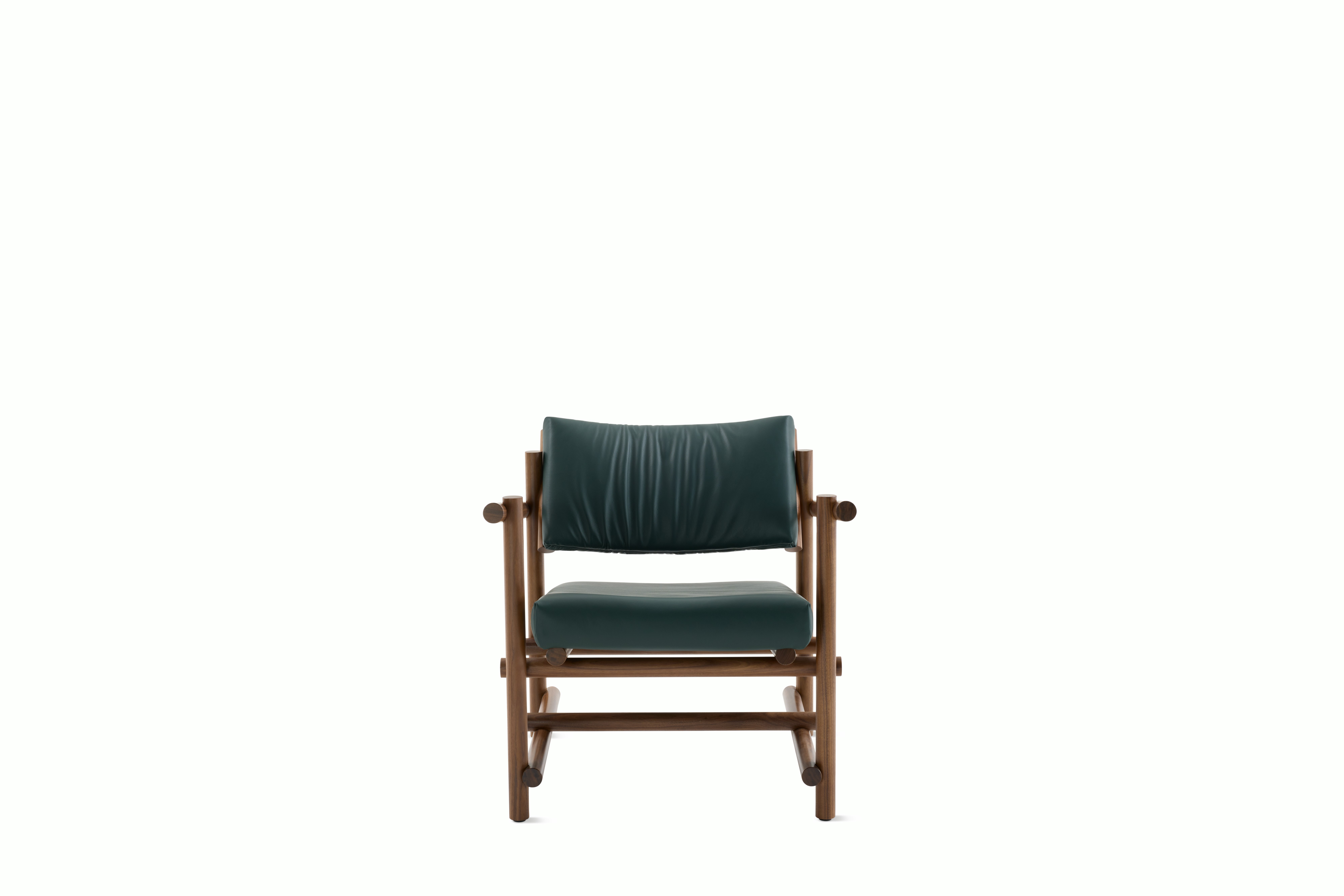 A Muecke Lounge Chair in Forest Green Walnut viewed from the front.