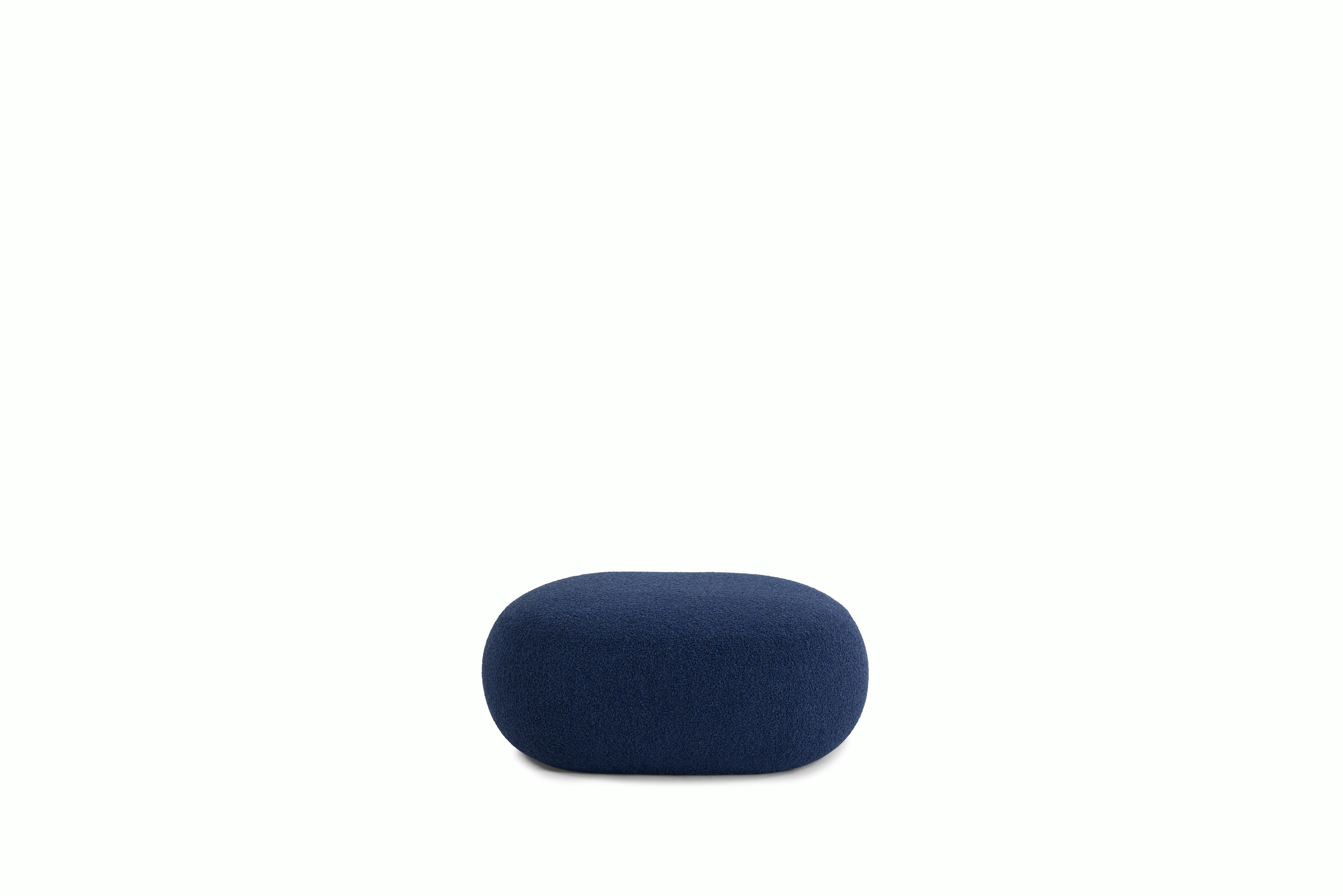 A Biboni Ottoman in Solid Sublime, Navy viewed from the side.