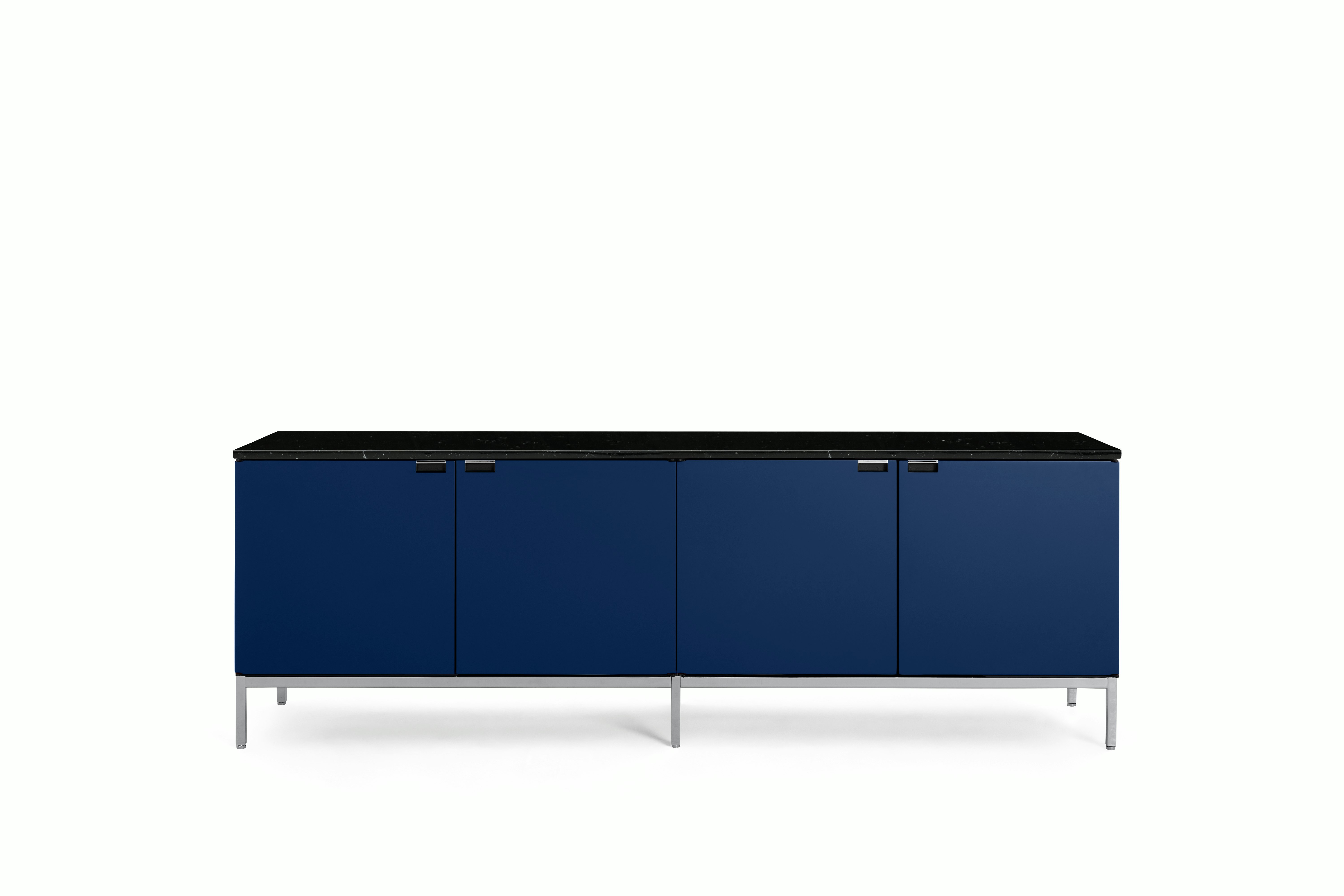A Florence Knoll Credenza in Large, Four Cabinet, Iris Lacquer, Polished Coated Marble, Nero Marquina viewed from the front.