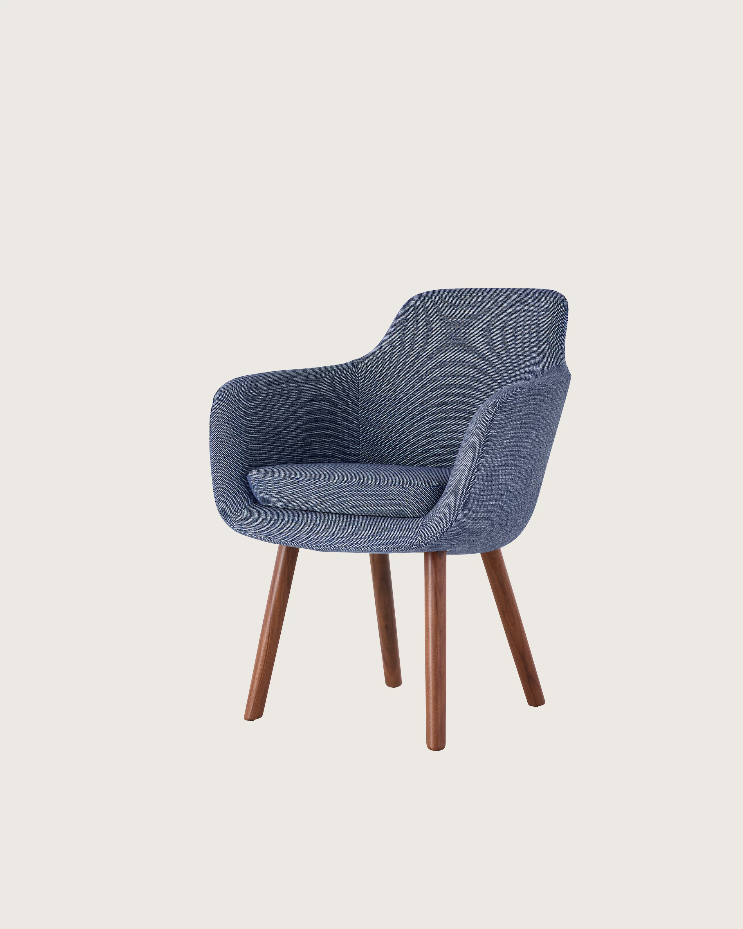 Partial view of a Saiba Side Chair with blue fabric.