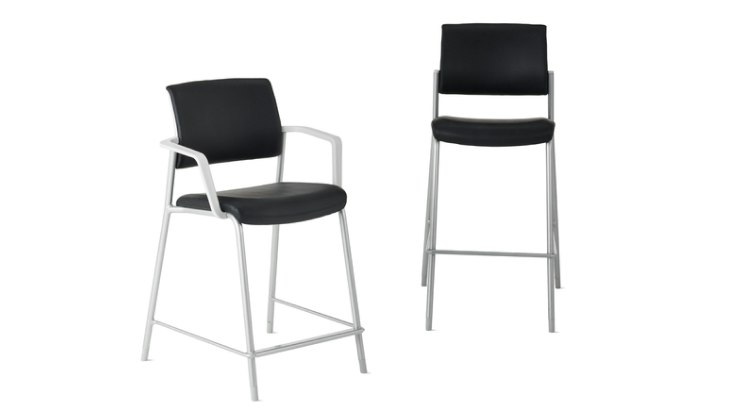 Front-angle view of Verus Fixed-Height Stool and Verus Easy Access Chair with waterfall seat edge in black with silver base.