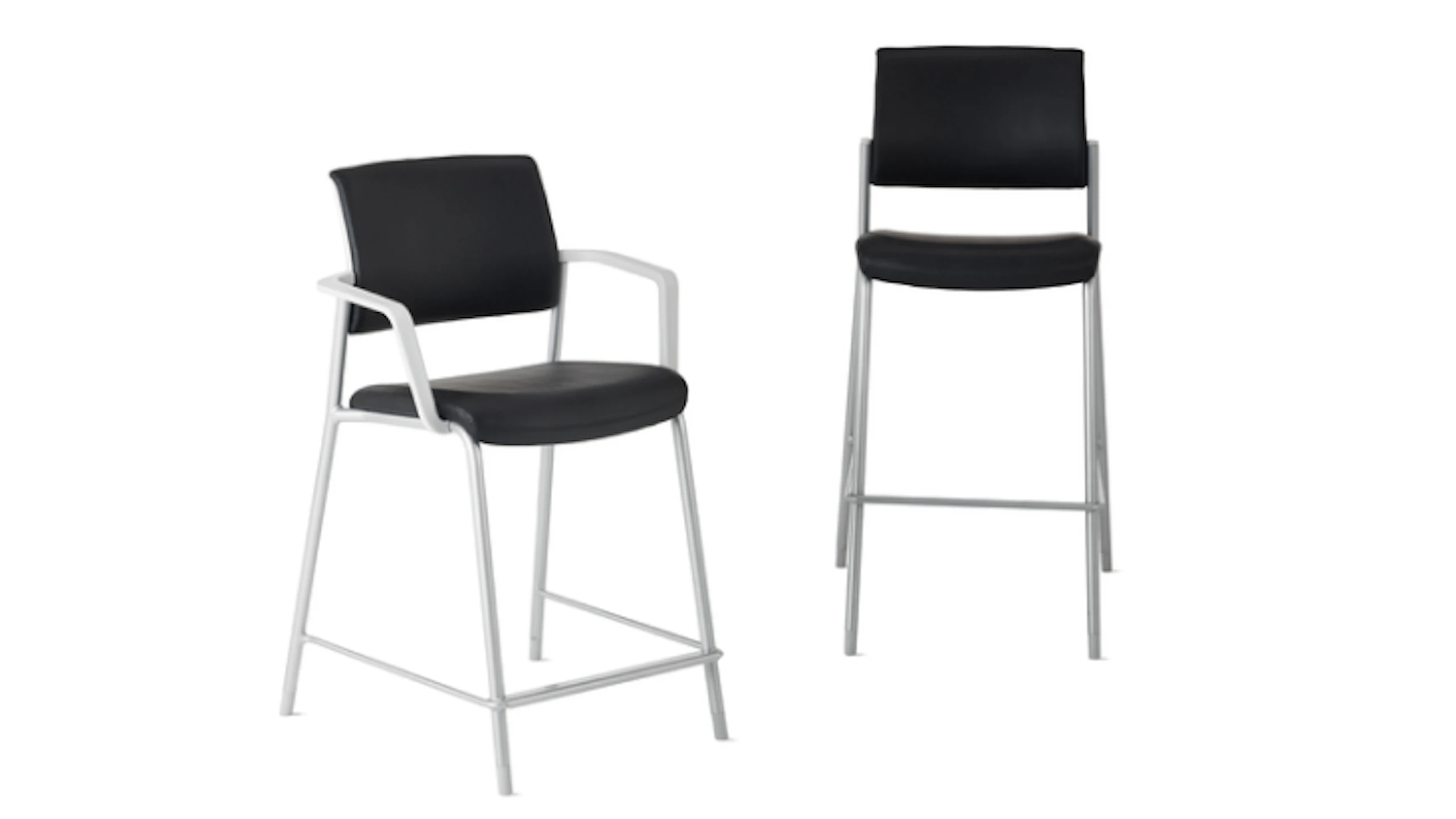 Front-angle view of Verus Fixed-Height Stool and Verus Easy Access Chair with waterfall seat edge in black with silver base.