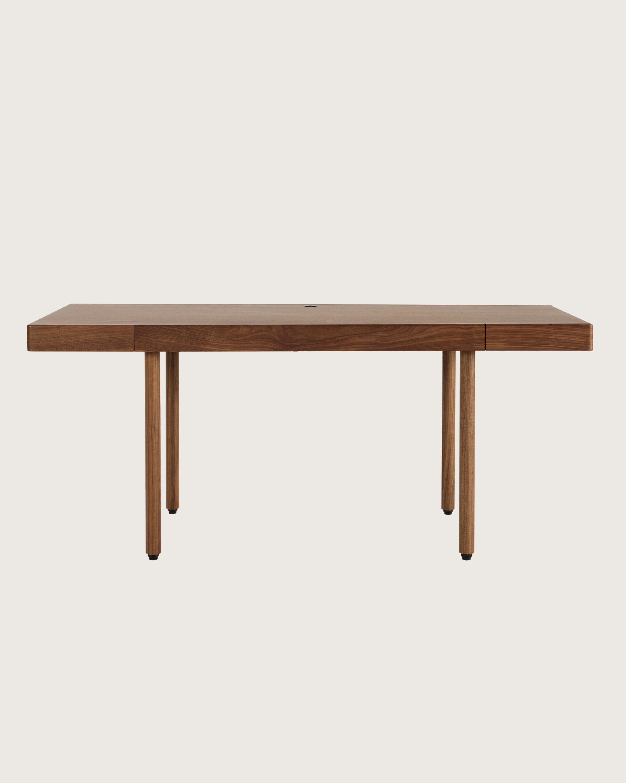 A New Canaan Wood Sit-to-Stand Desk in Walnut viewed from the front.