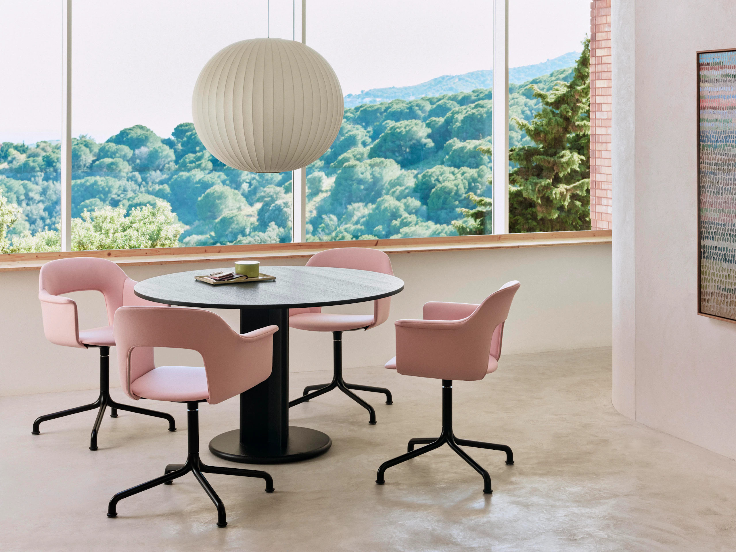 Four Layout armchairs on arc base around Chisel column base table