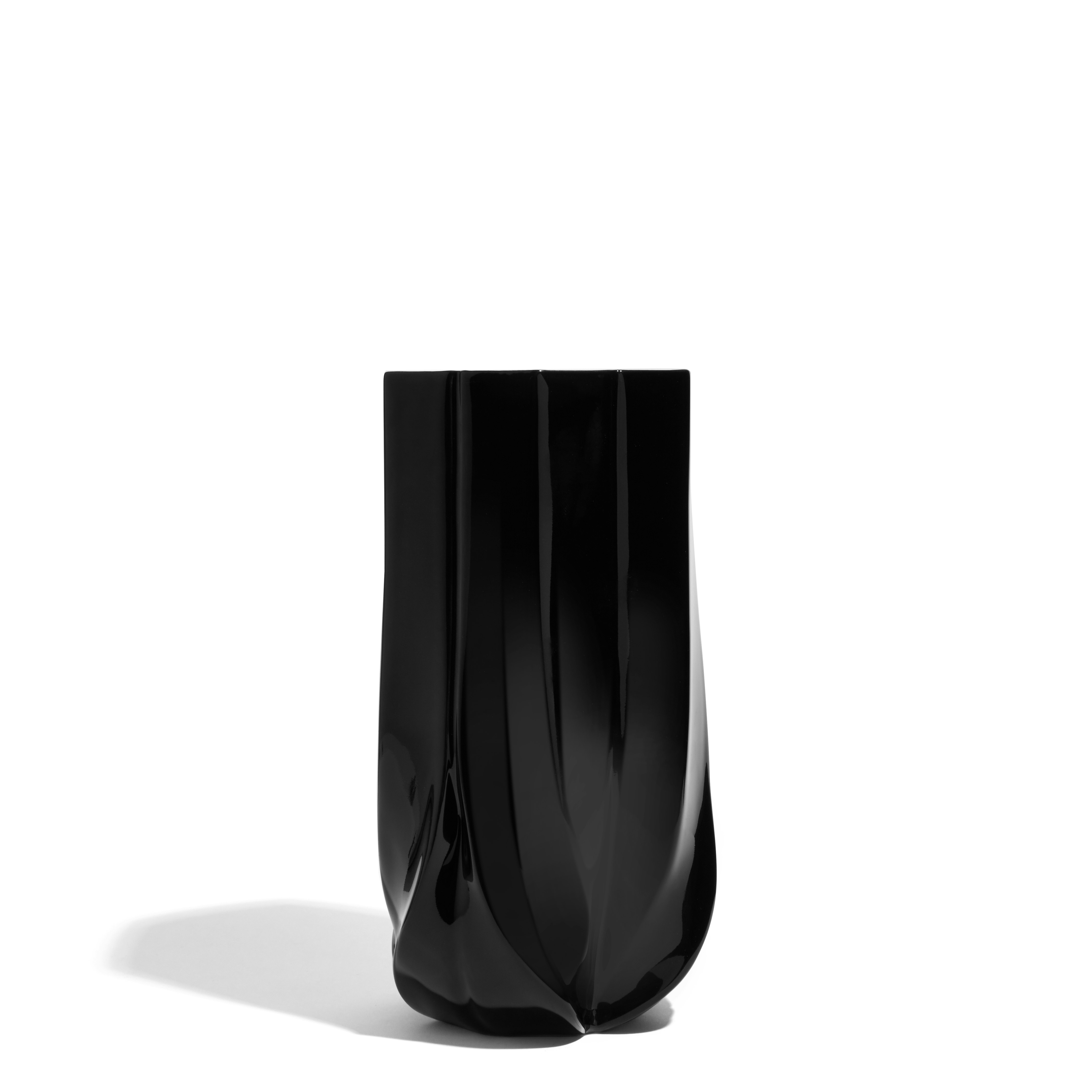 A Braid Vase in Wide, Black viewed from an angle.