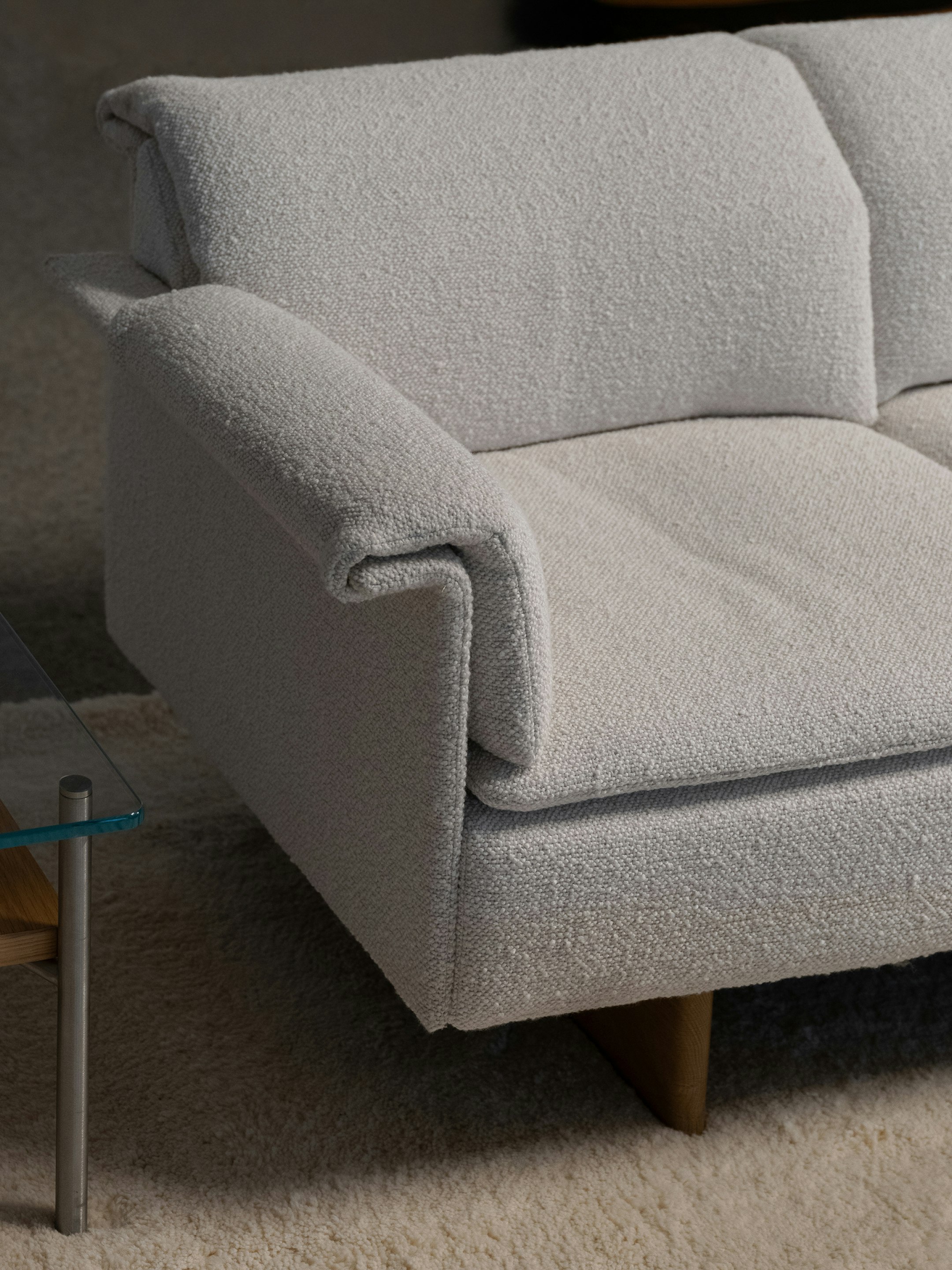 Partial view of light-colored Mantle Sofa
