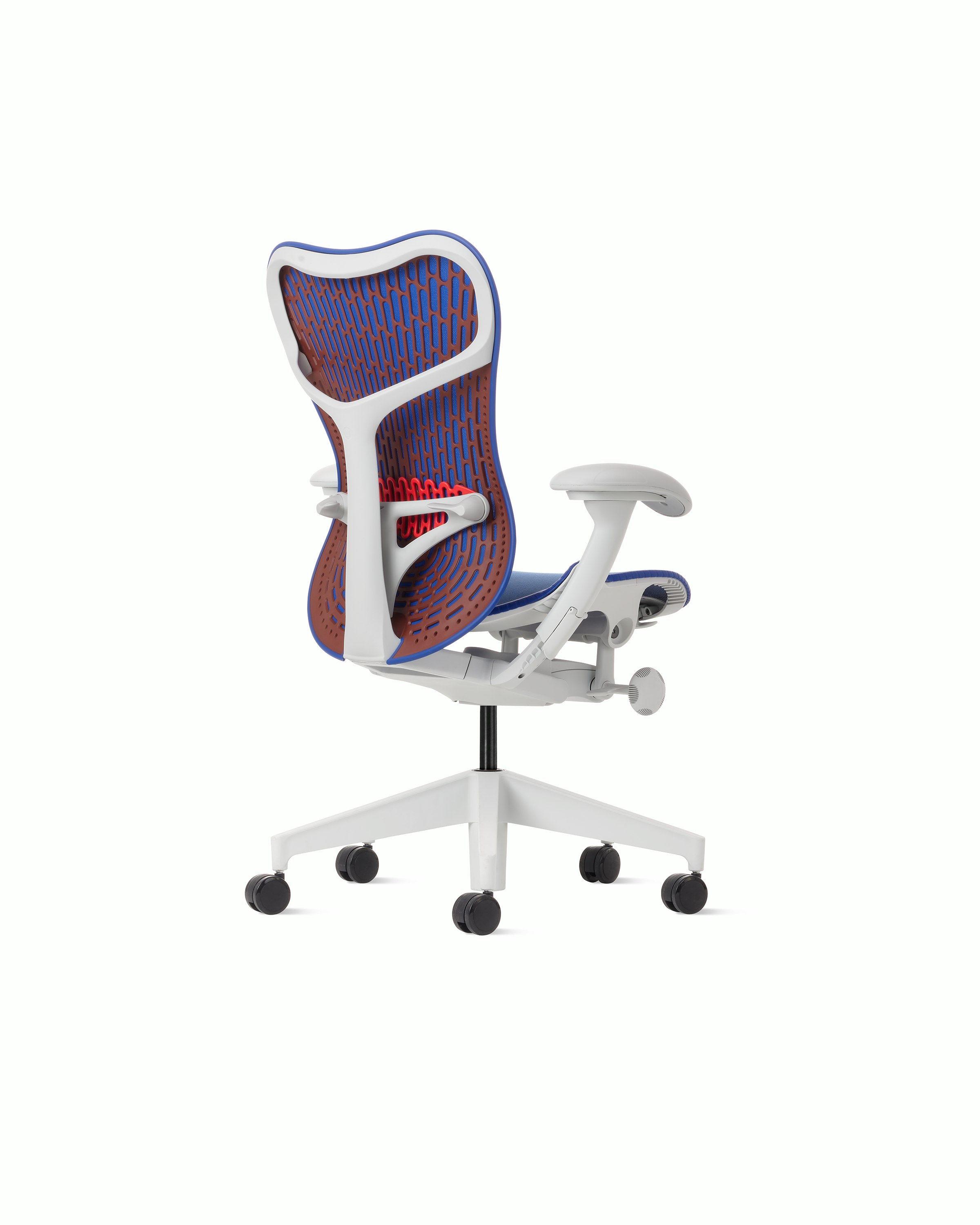 Rear angle view of a Mirra 2 chair with a Butterfly back in ultramarine color-block and alpine frame.