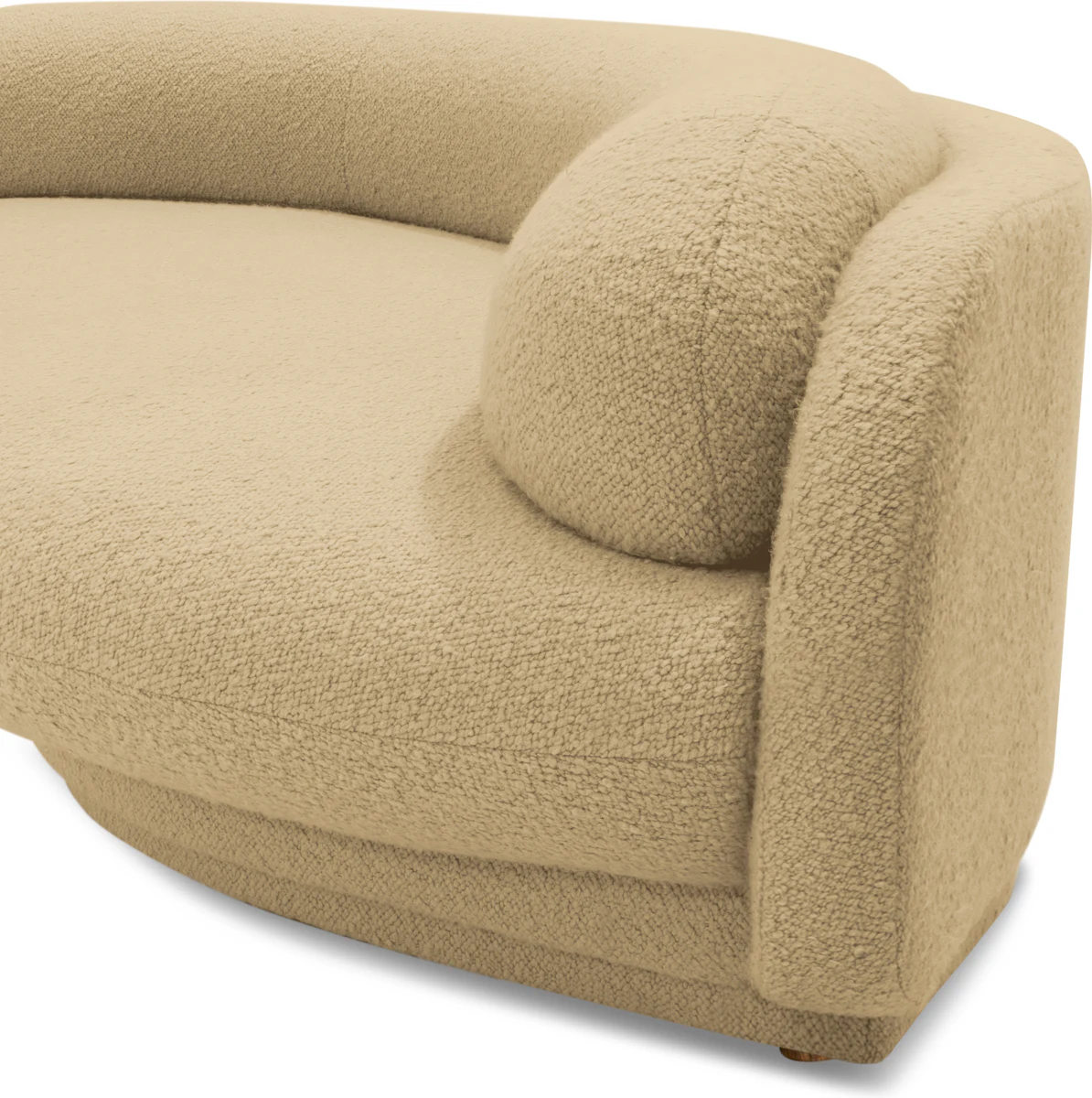 A beige curved sofa with rounded armrest and plush upholstery
